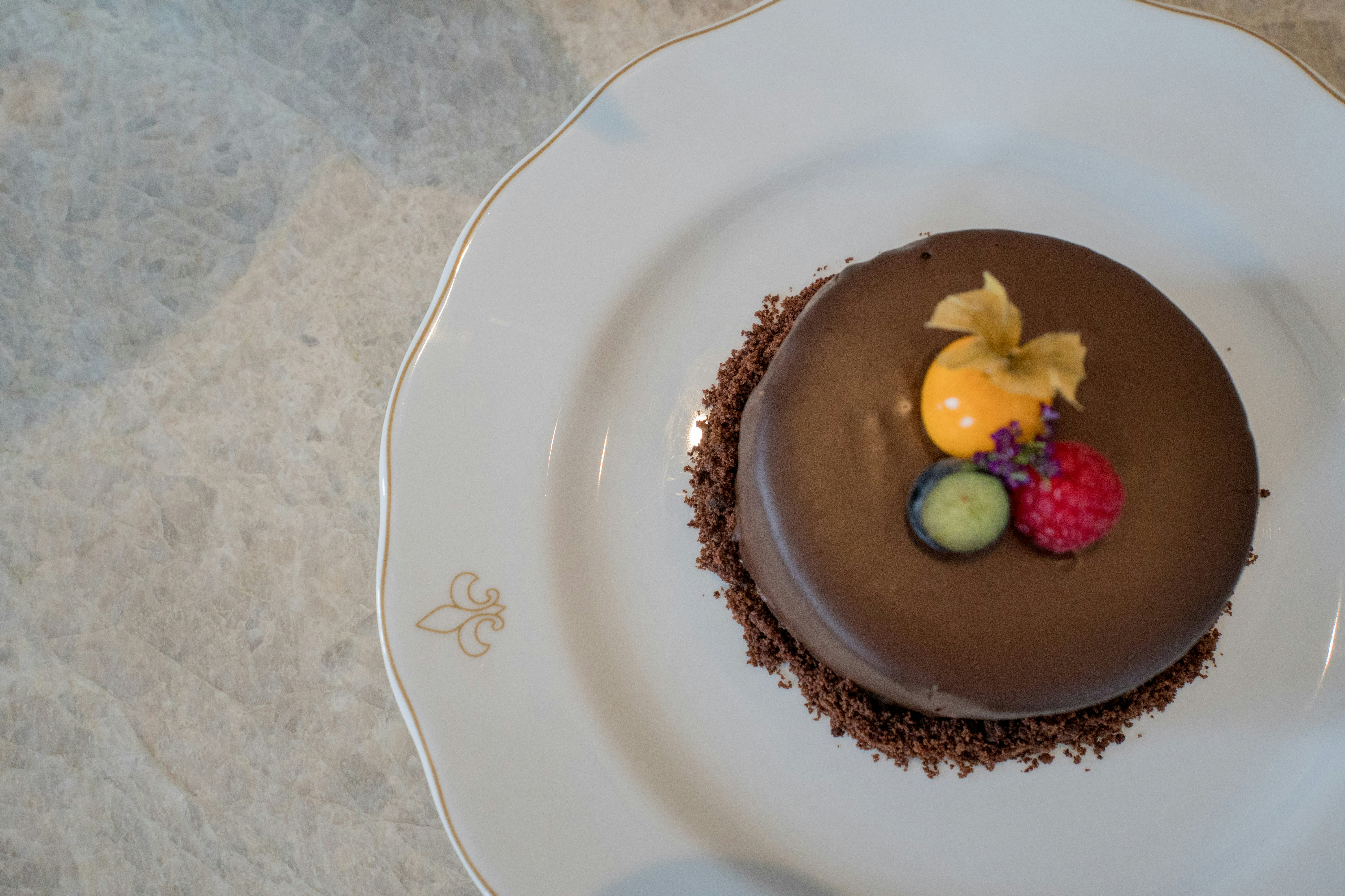 Swiss chocolate dessert at a candlelit restaurant — dining in Switzerland honeymoon | Safari Sutra