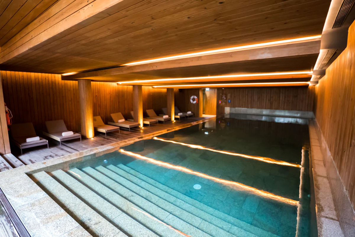 Indoor hotel pool with wooden accents