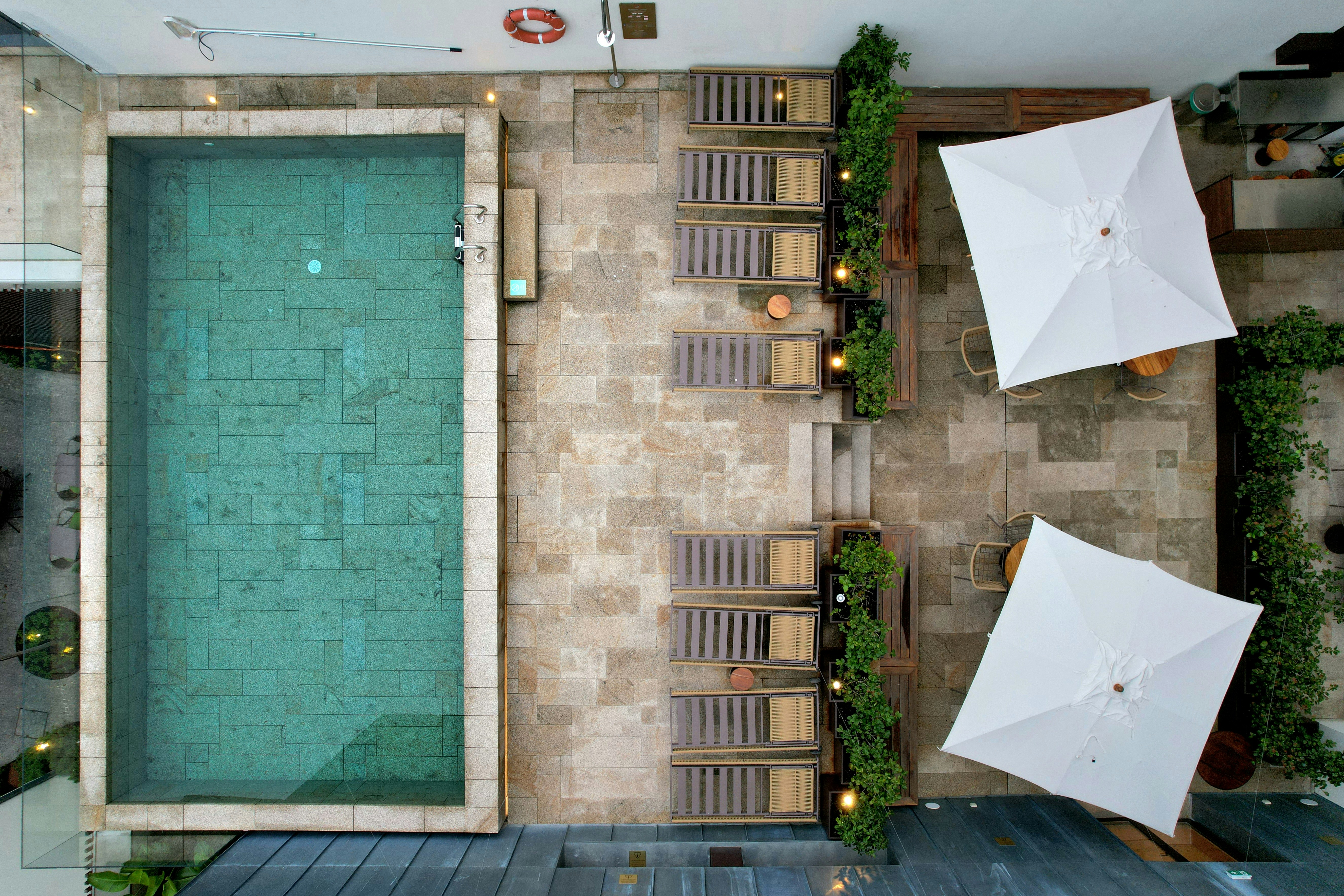 Aerial view of a swimming pool and lounge chairs