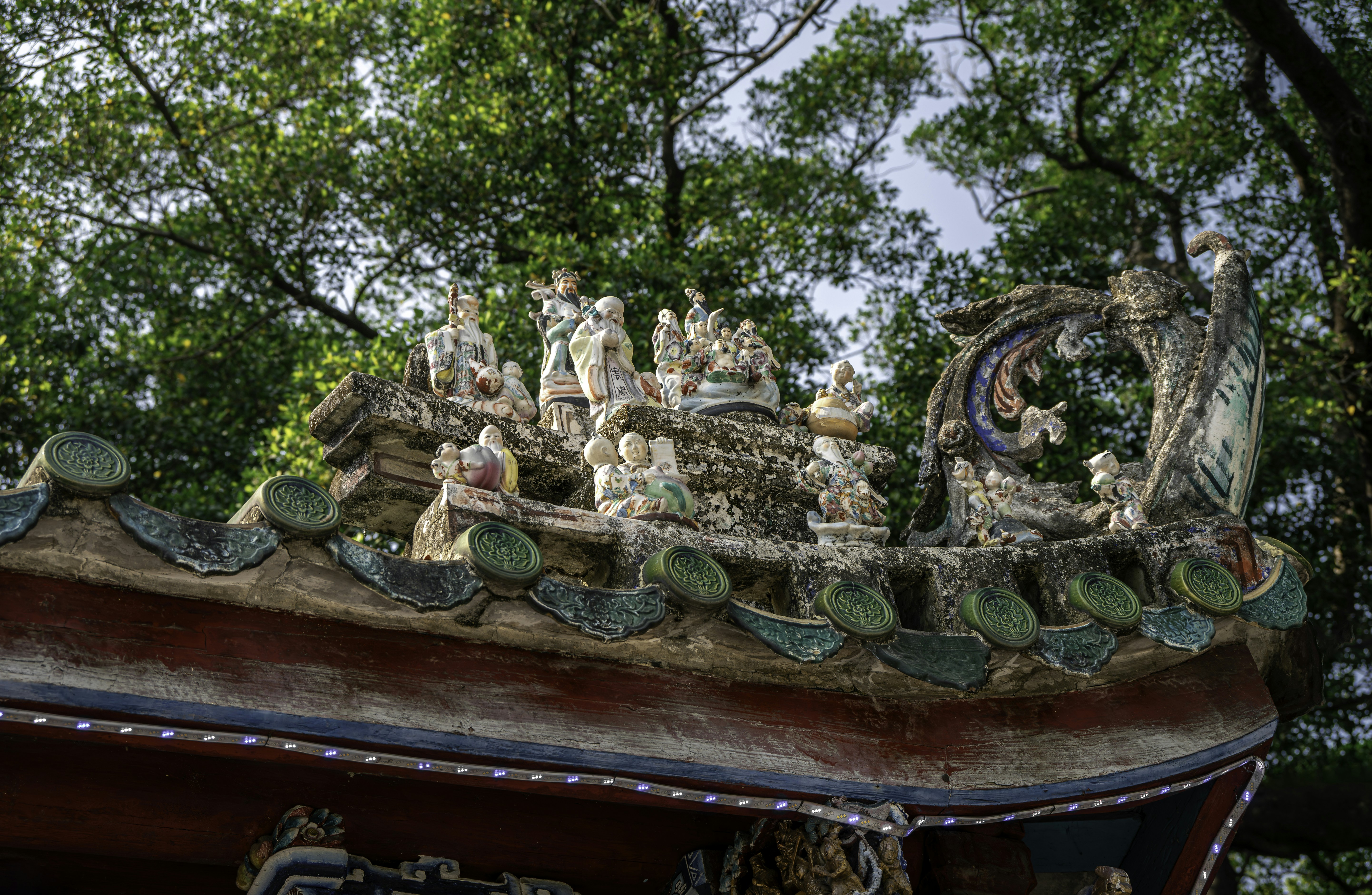 Ornate roof with ceramic figures and green tiles