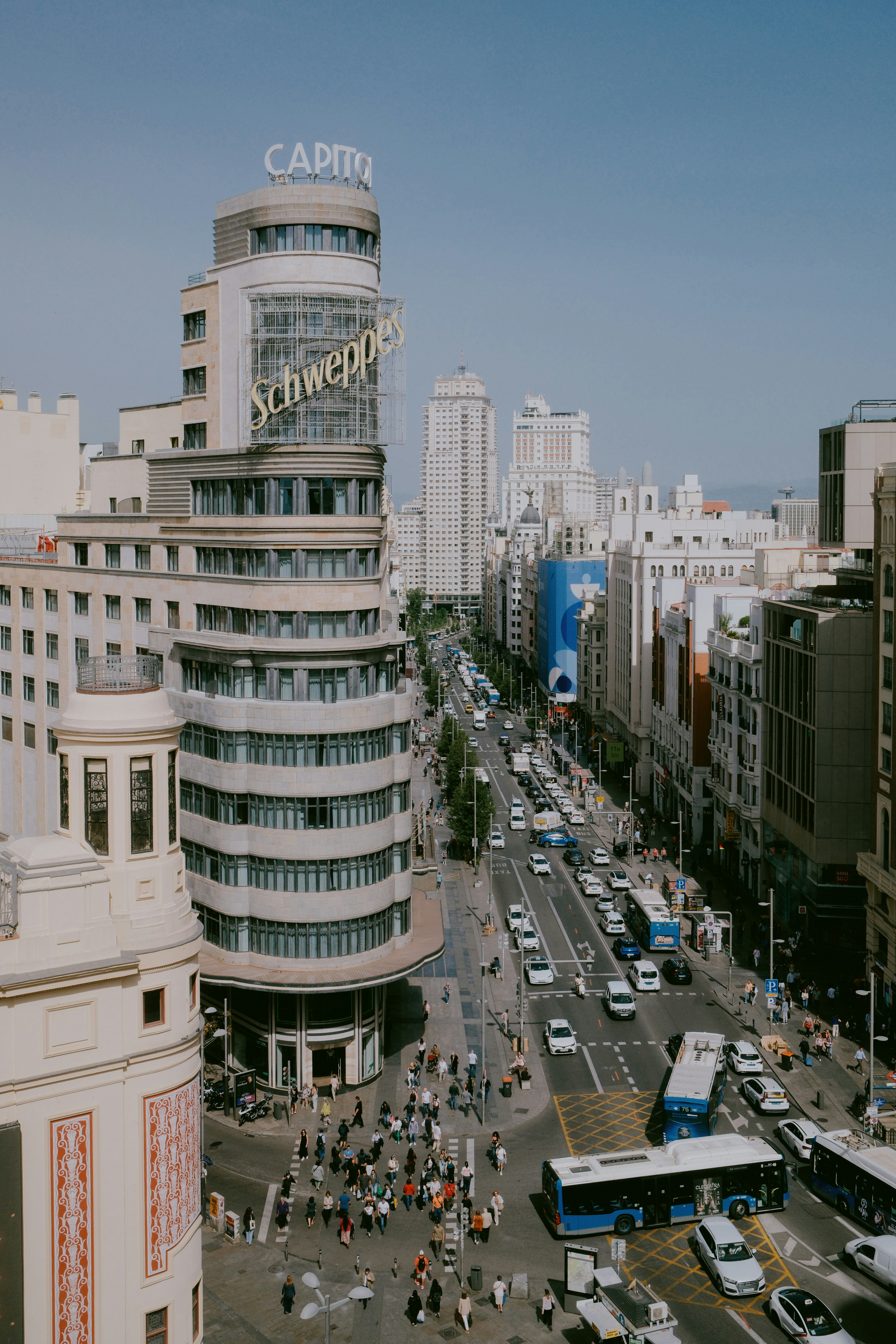Busy city street with iconic capitol building and traffic.
