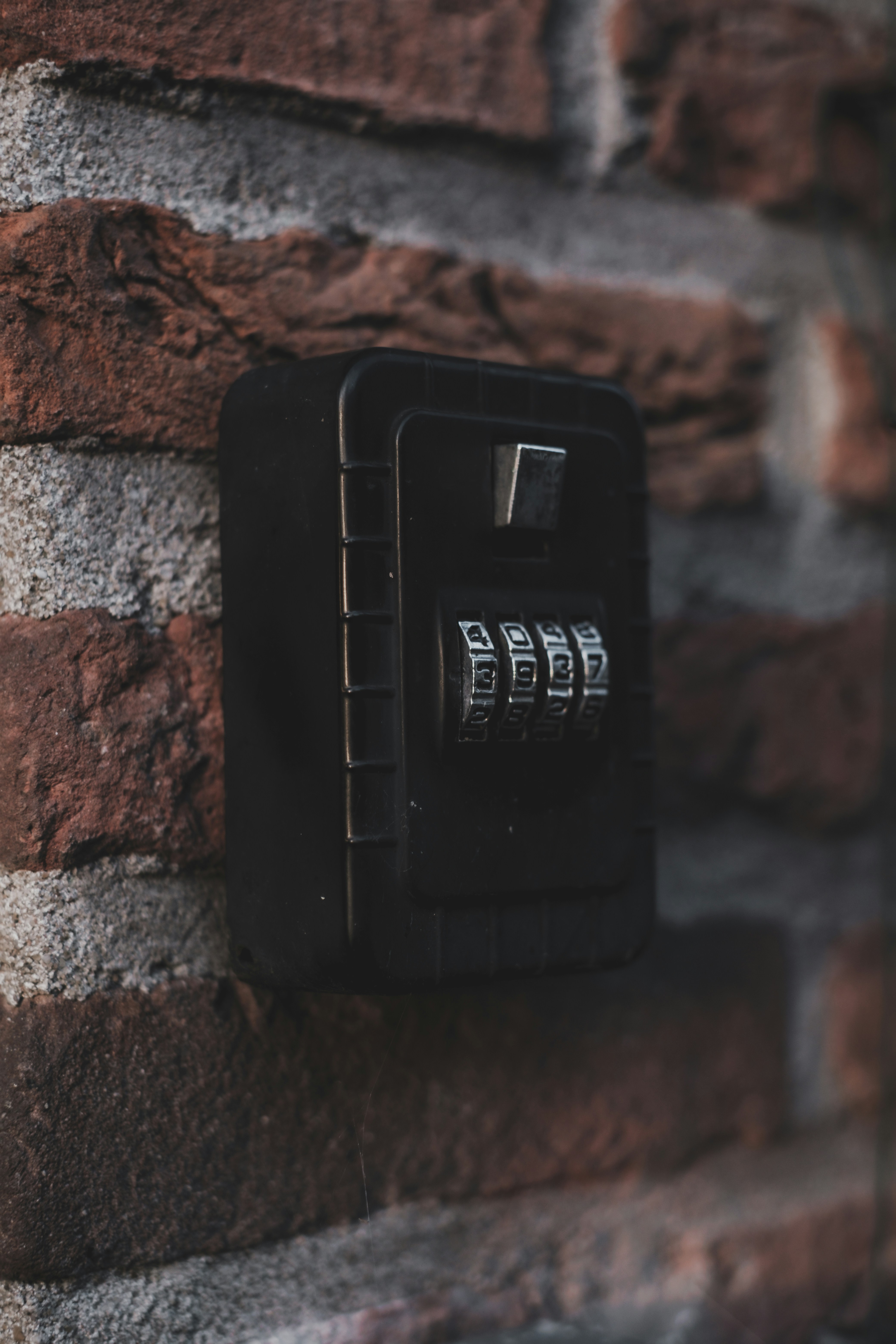key vault mounted on a brick wall