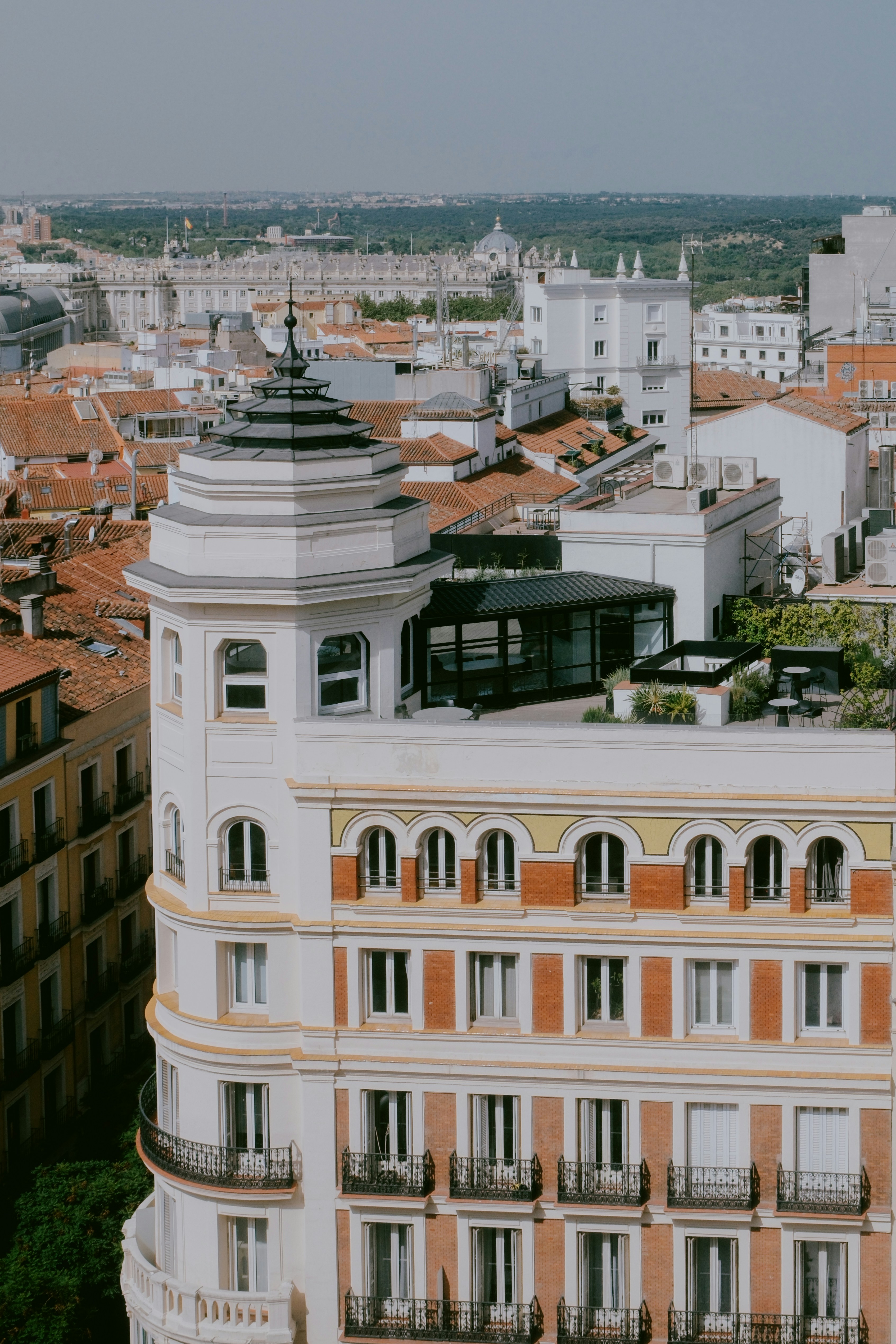 Ornate building facade with balconies and rooftop