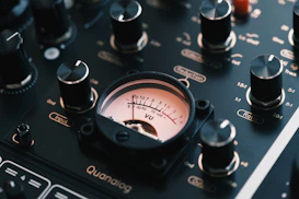 Close-up of a vintage audio mixer with vu meter