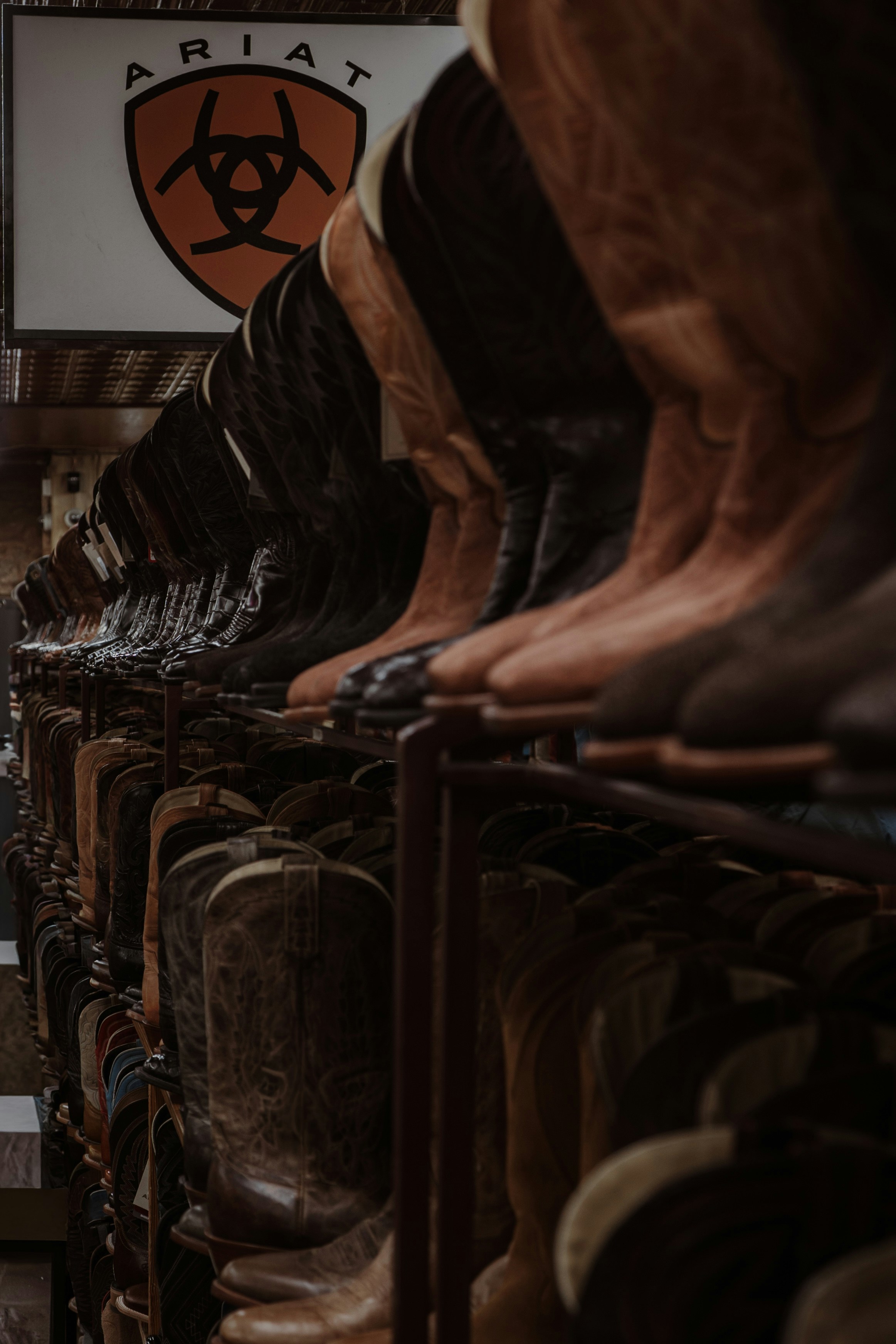 Row of cowboy boots with ariat logo