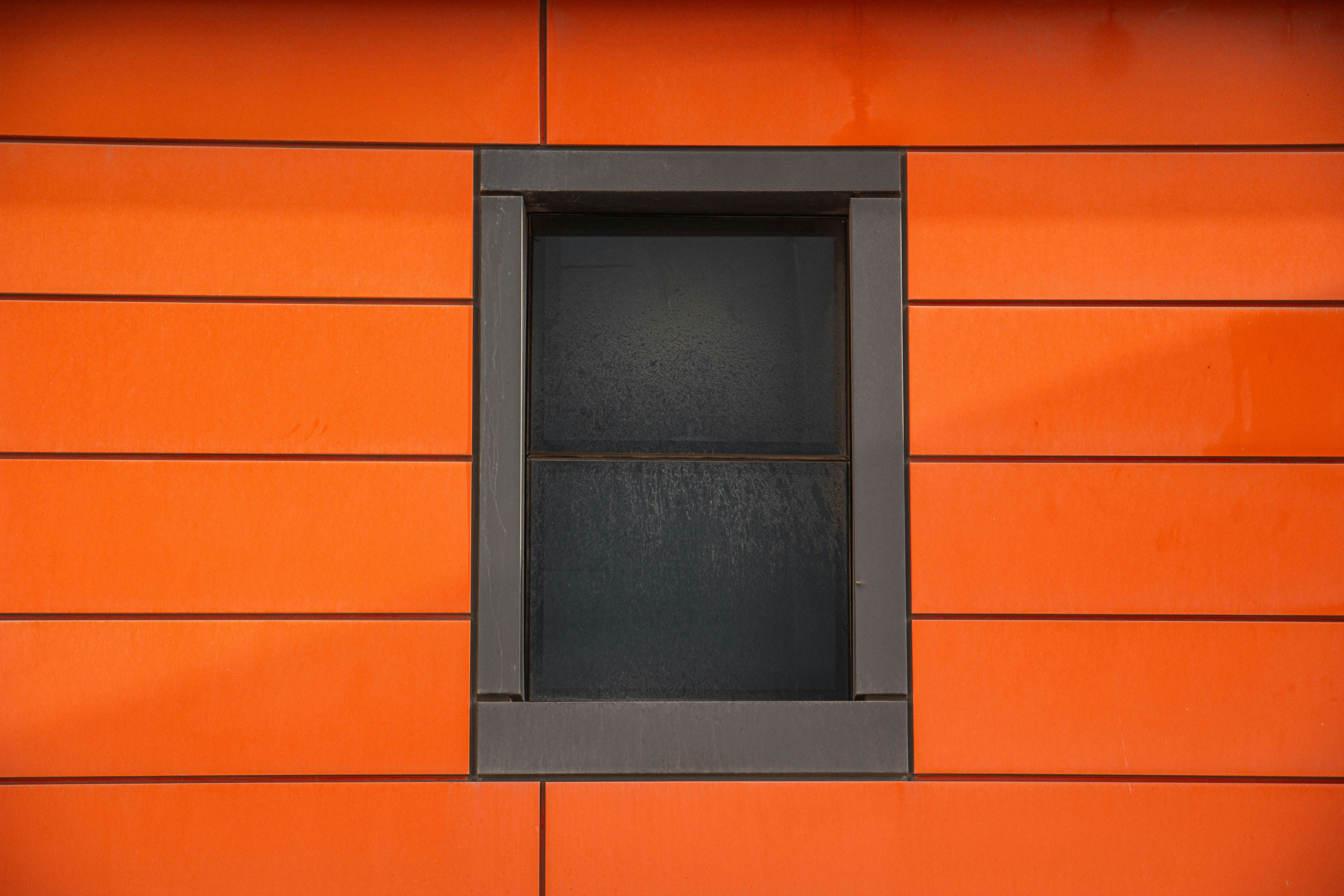 Orange wall with a dark recessed window