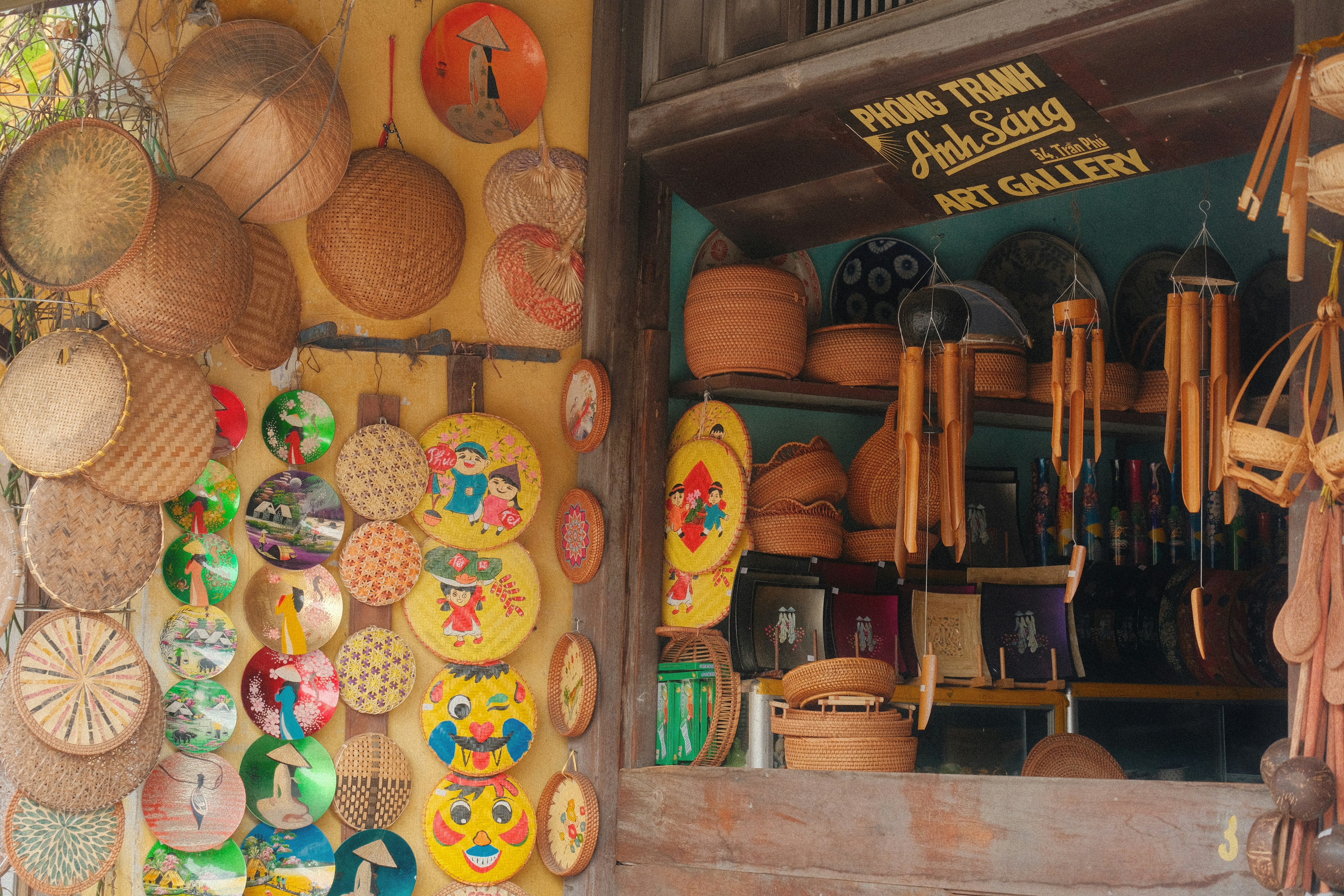 Woven baskets and decorative items displayed outside a shop.