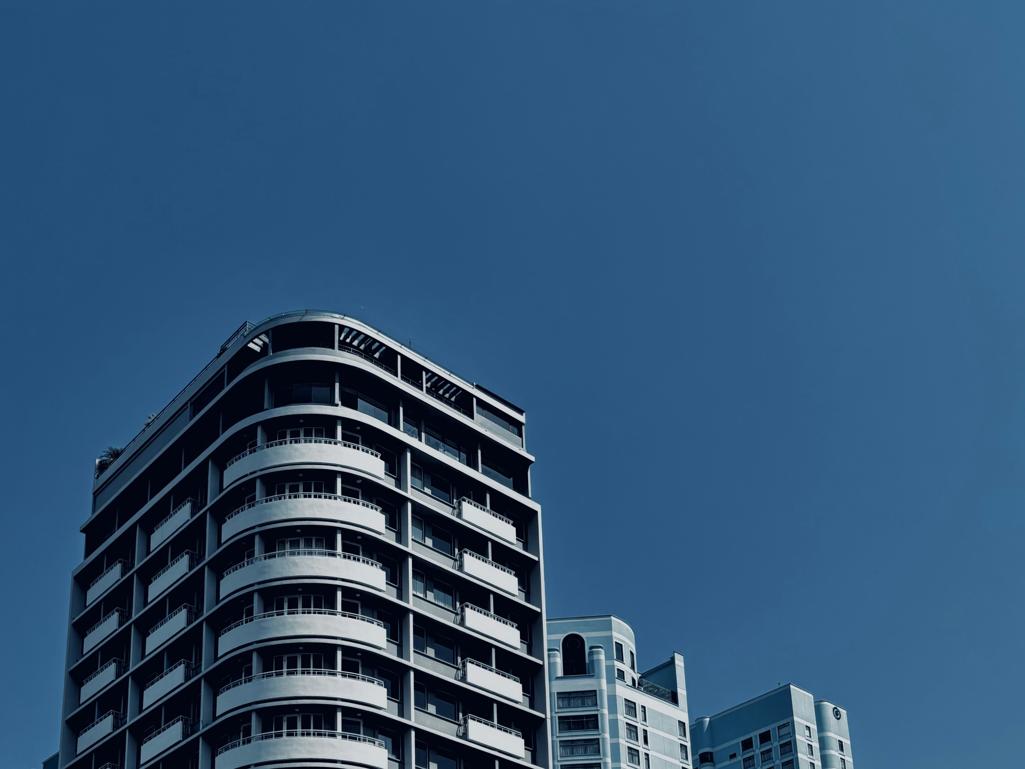 Modern buildings against a clear blue sky