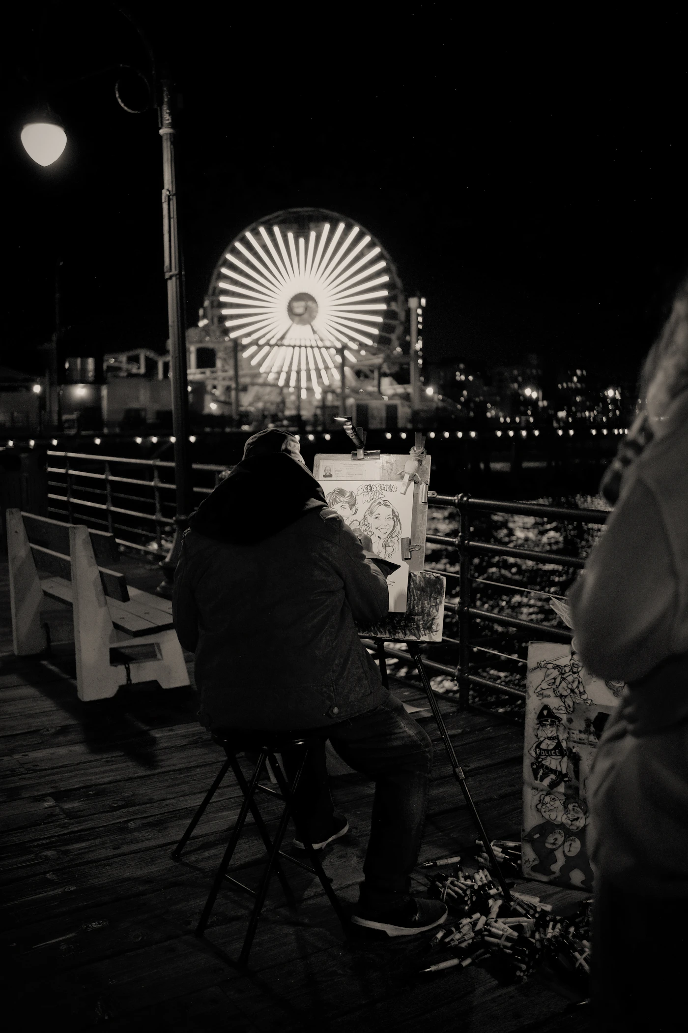 Artist drawing on pier