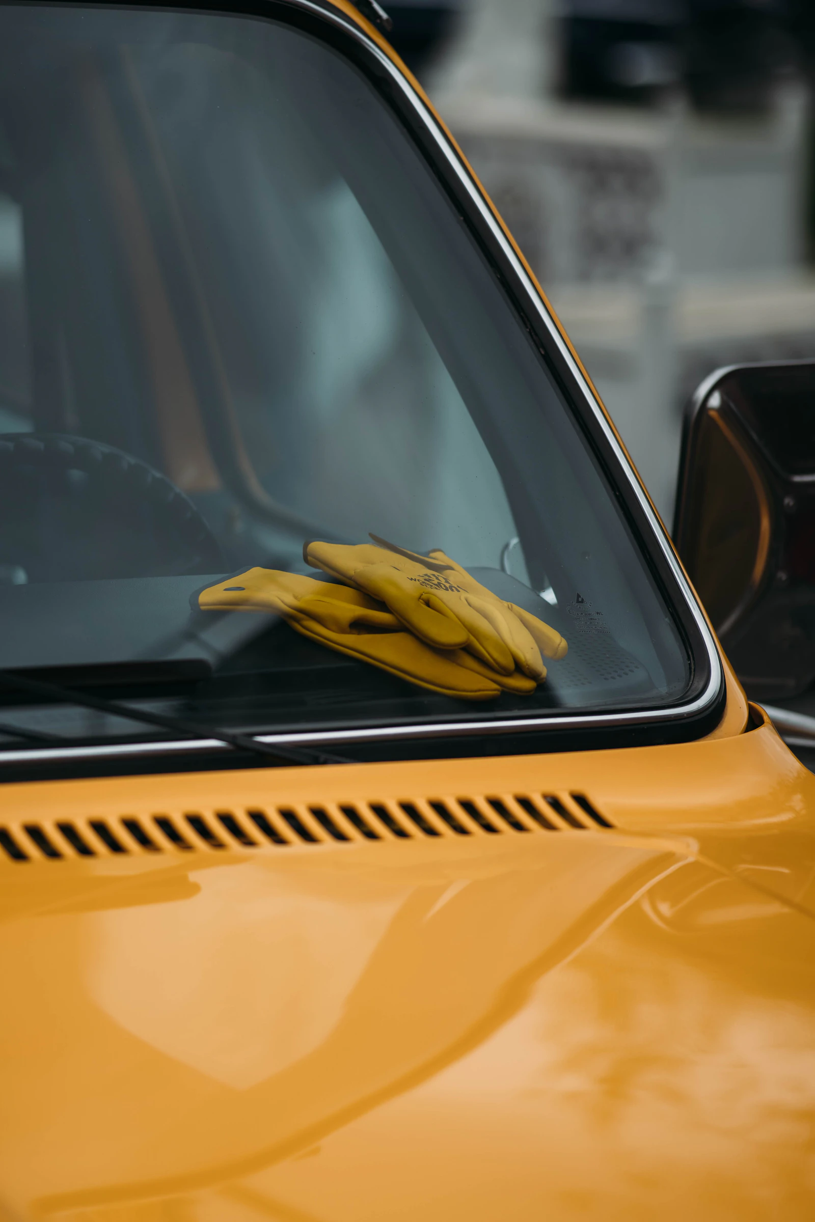 Yellow work gloves resting on a truck dashboard