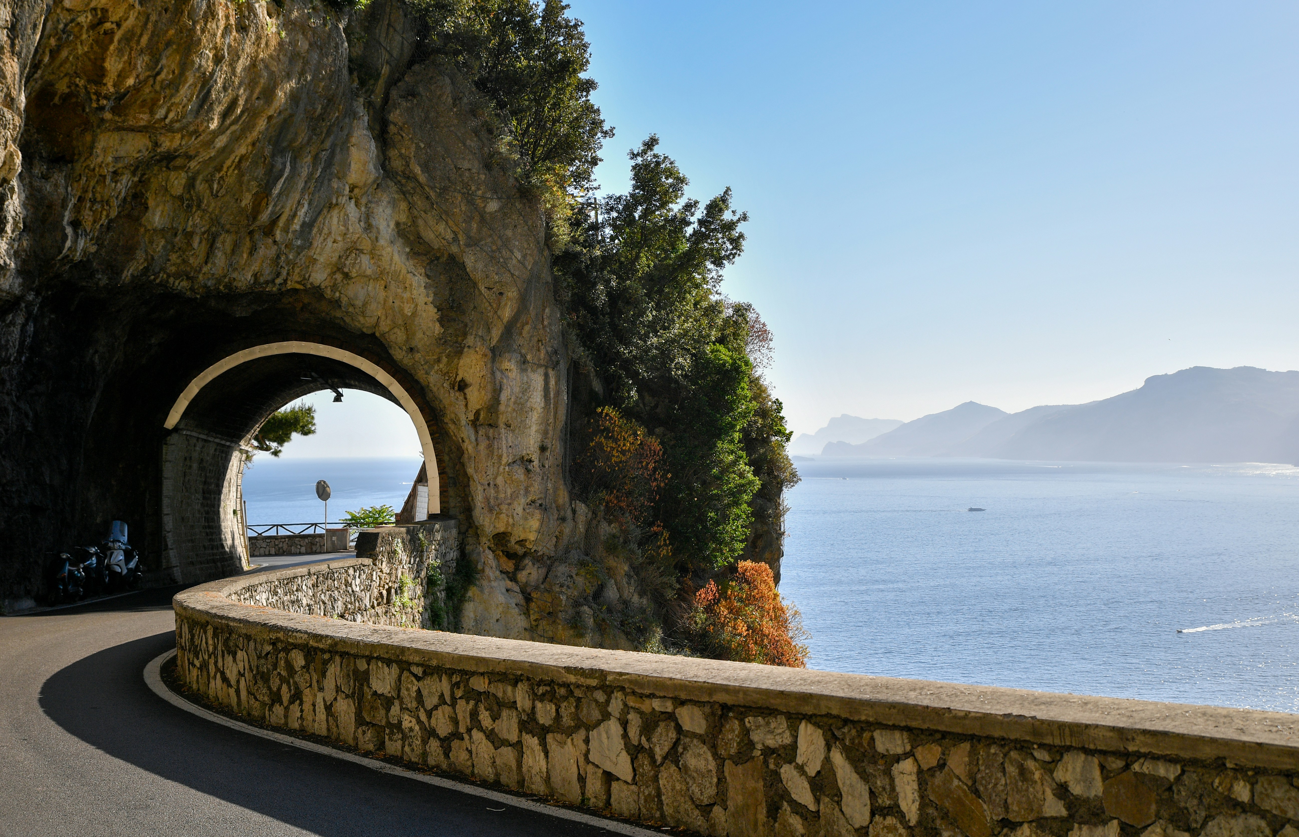 Amalfi Coast Drive — Hire a driver from Sorrento to Positano and Ravello for lemon groves, ceramic shops, and Tyrrhenian views.