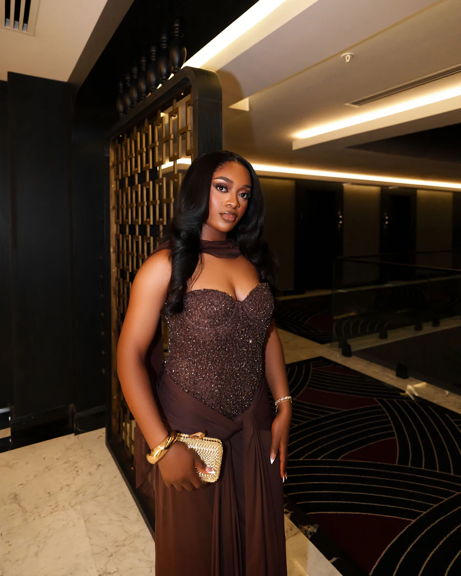 A customer at an evening event with her bag