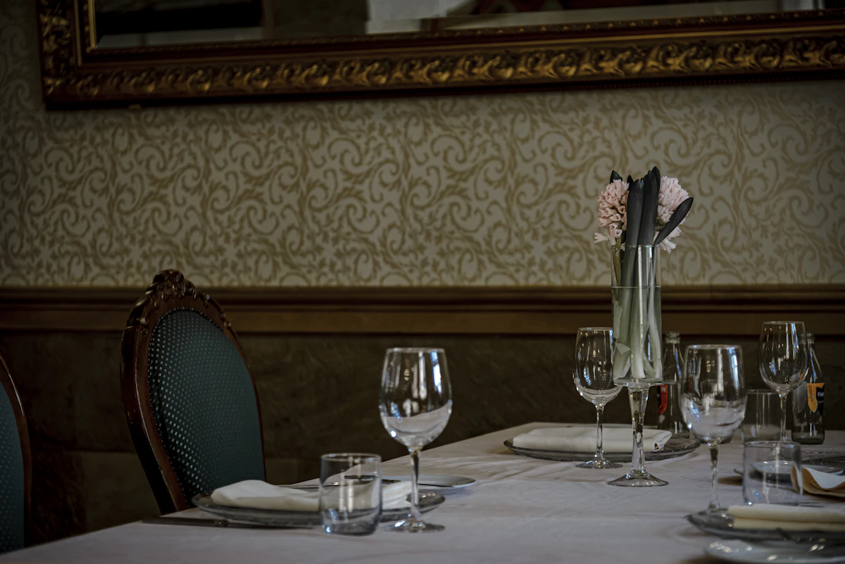 Table set for a meal with wine glasses