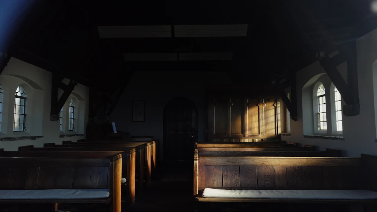 Empty church pews with sunlight