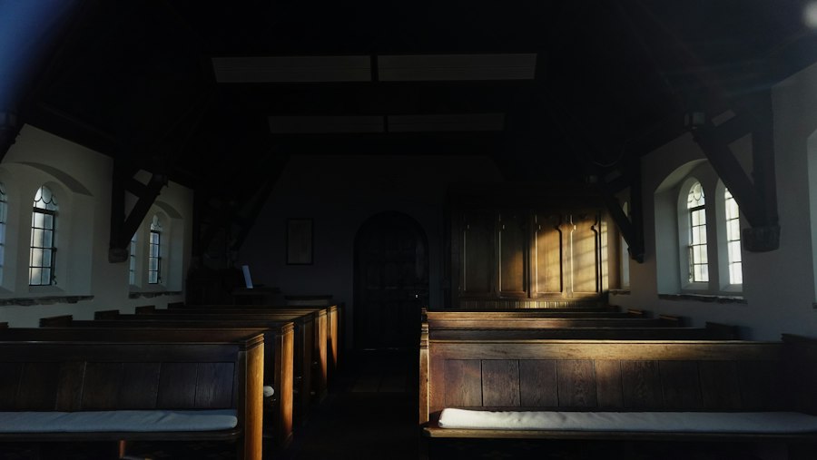 Quiet wooden chapel pews in soft afternoon light