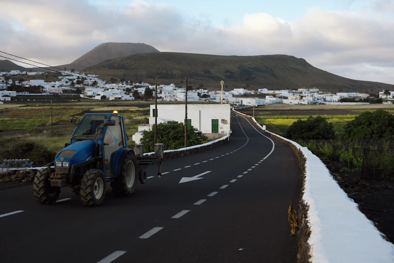 Tractor on the road into the village
