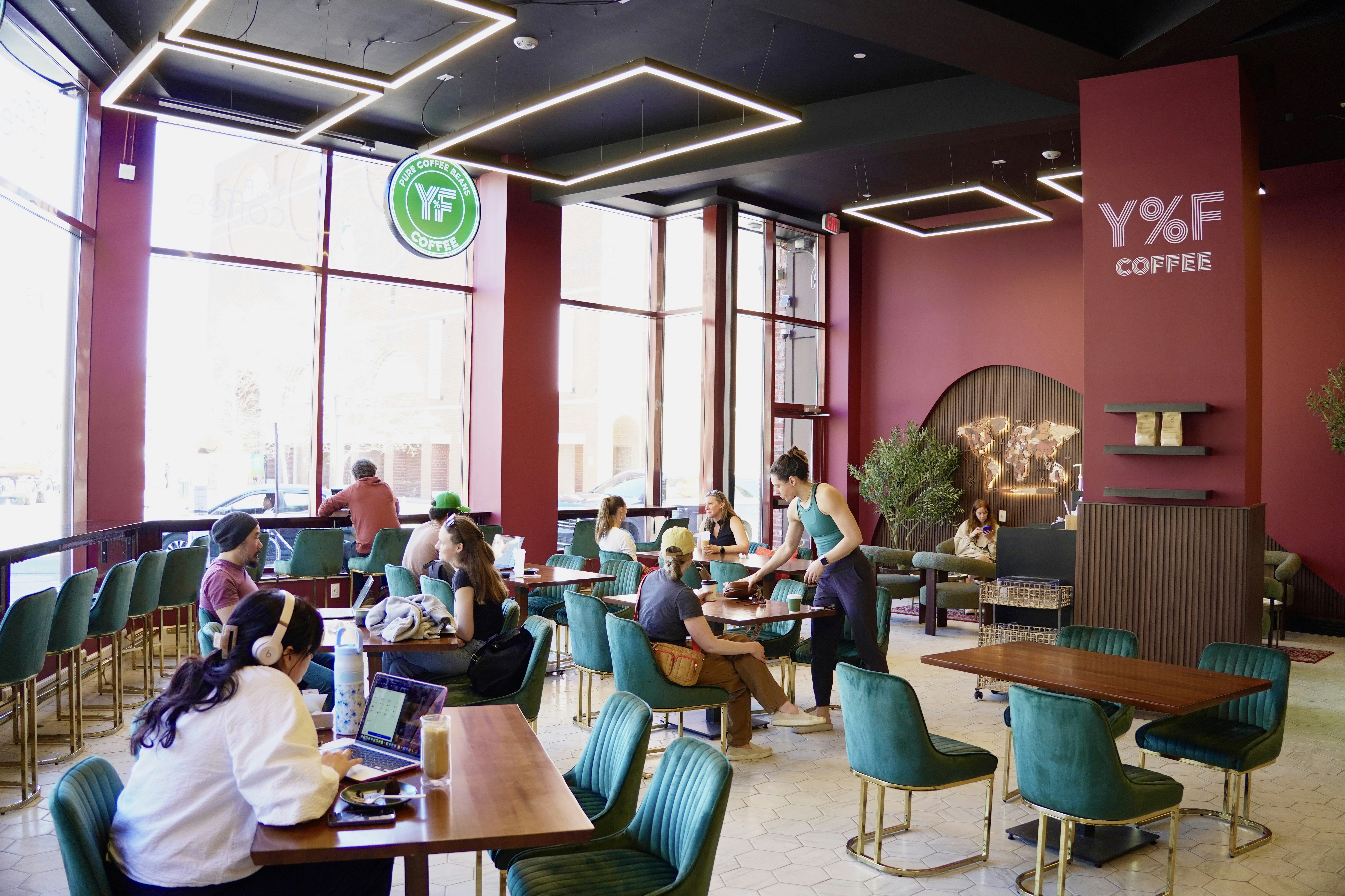 People working and socializing in a modern coffee shop