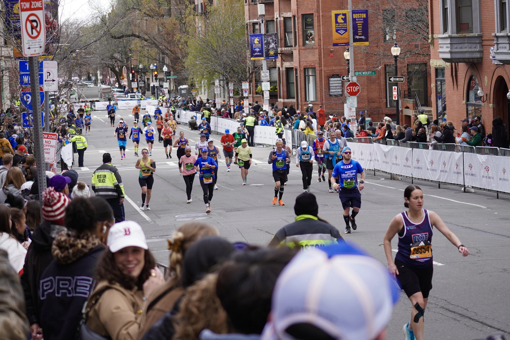 Runners on Boylston Street with spectators lining the road, running Boston on marathon day