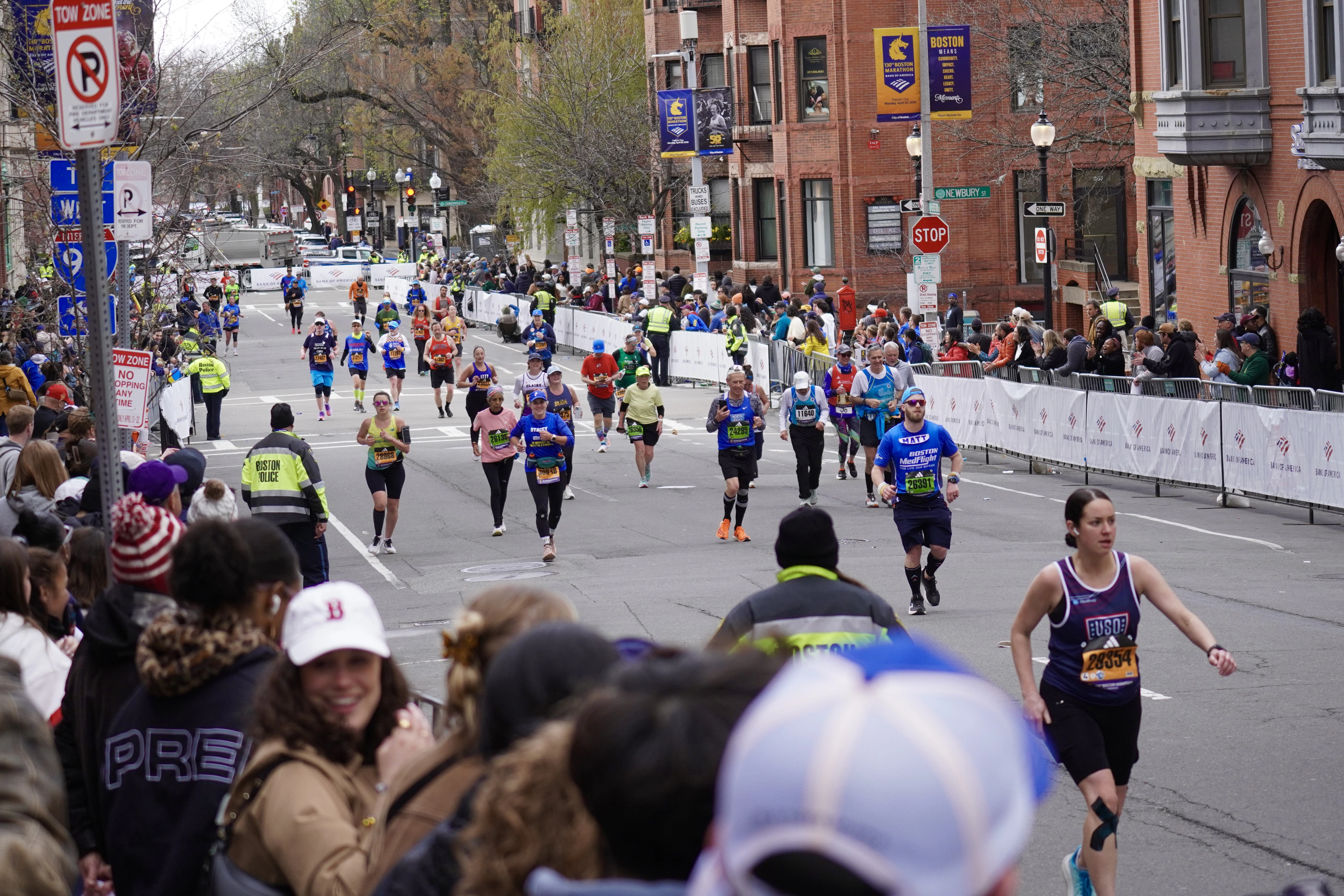 Runners on Boylston Street with spectators lining the road, running Boston on marathon day