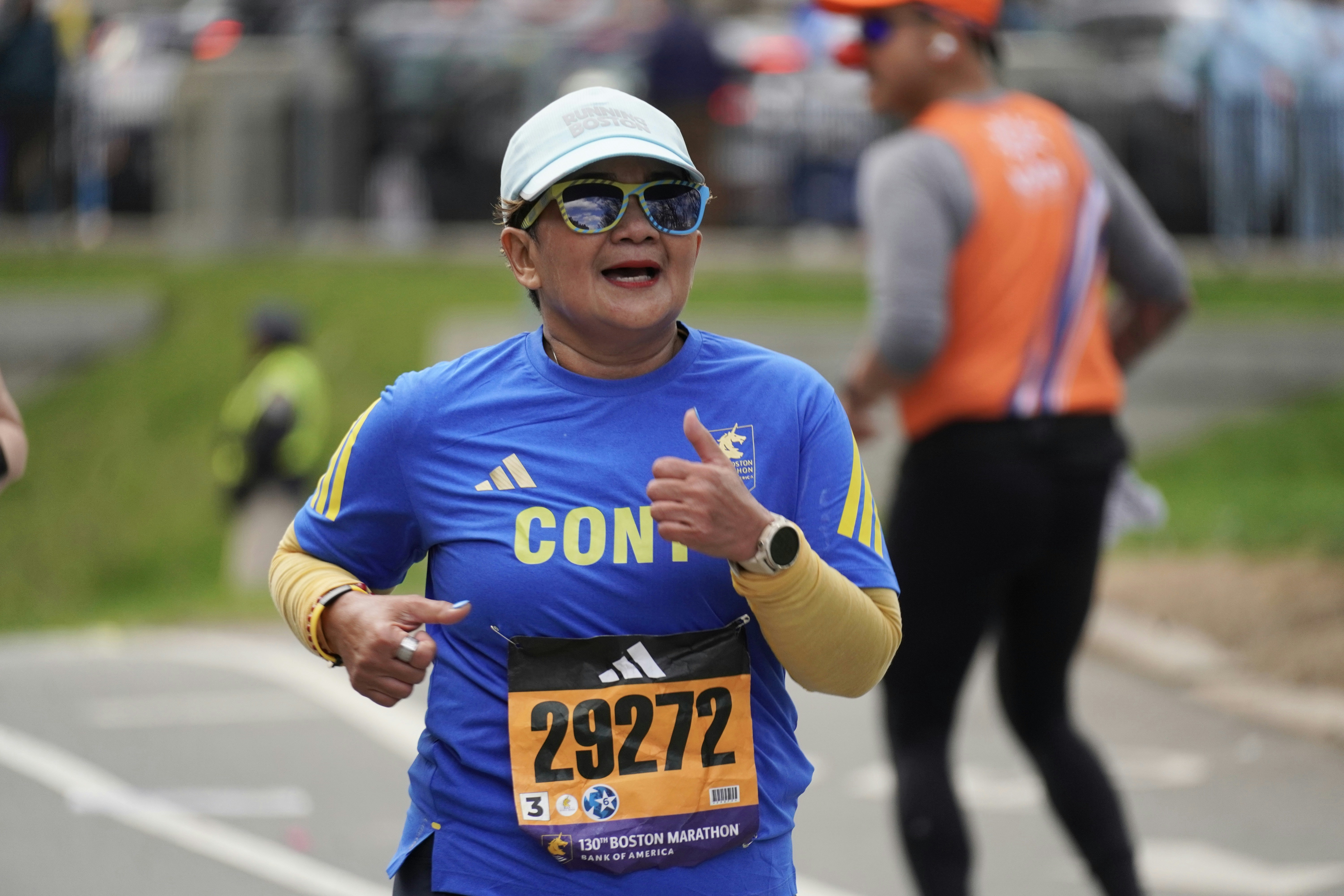 Woman running a marathon with bib number 29272.