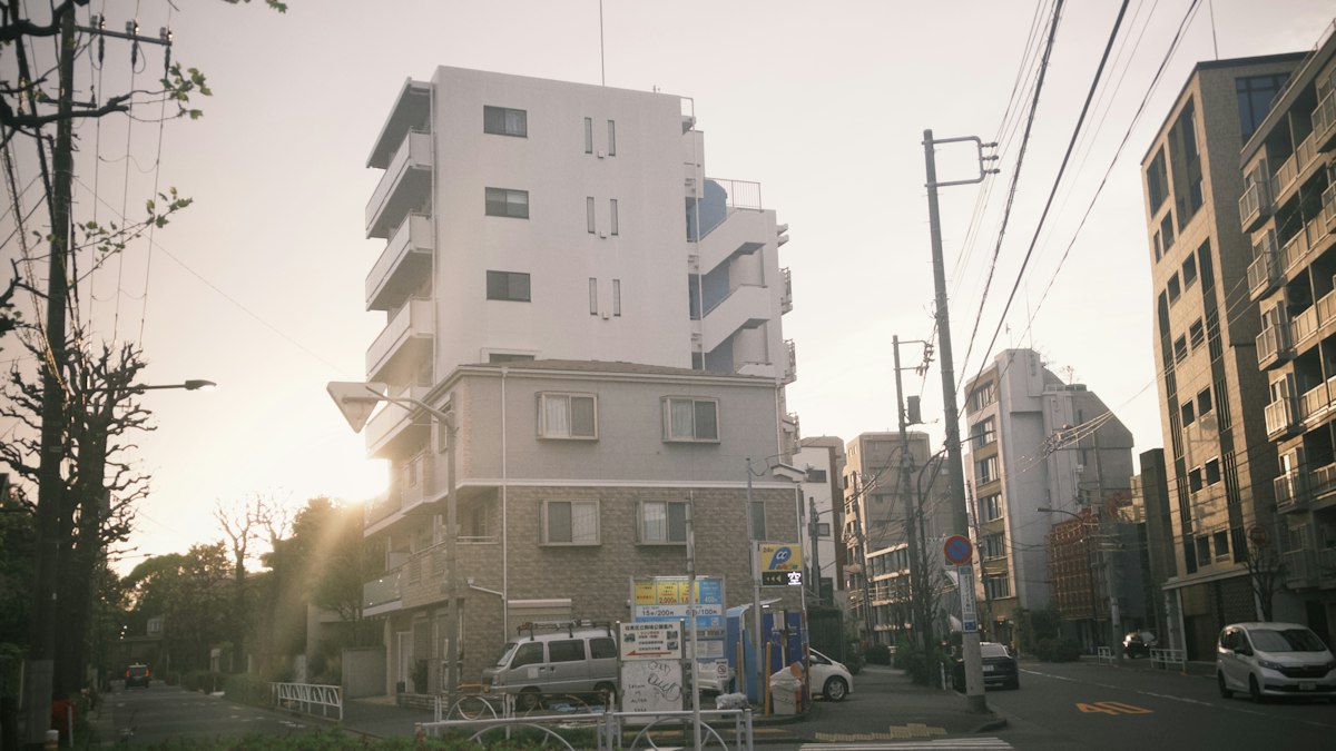Street lined with low- to mid-rise apartment buildings in a Japanese residential neighborhood (image)