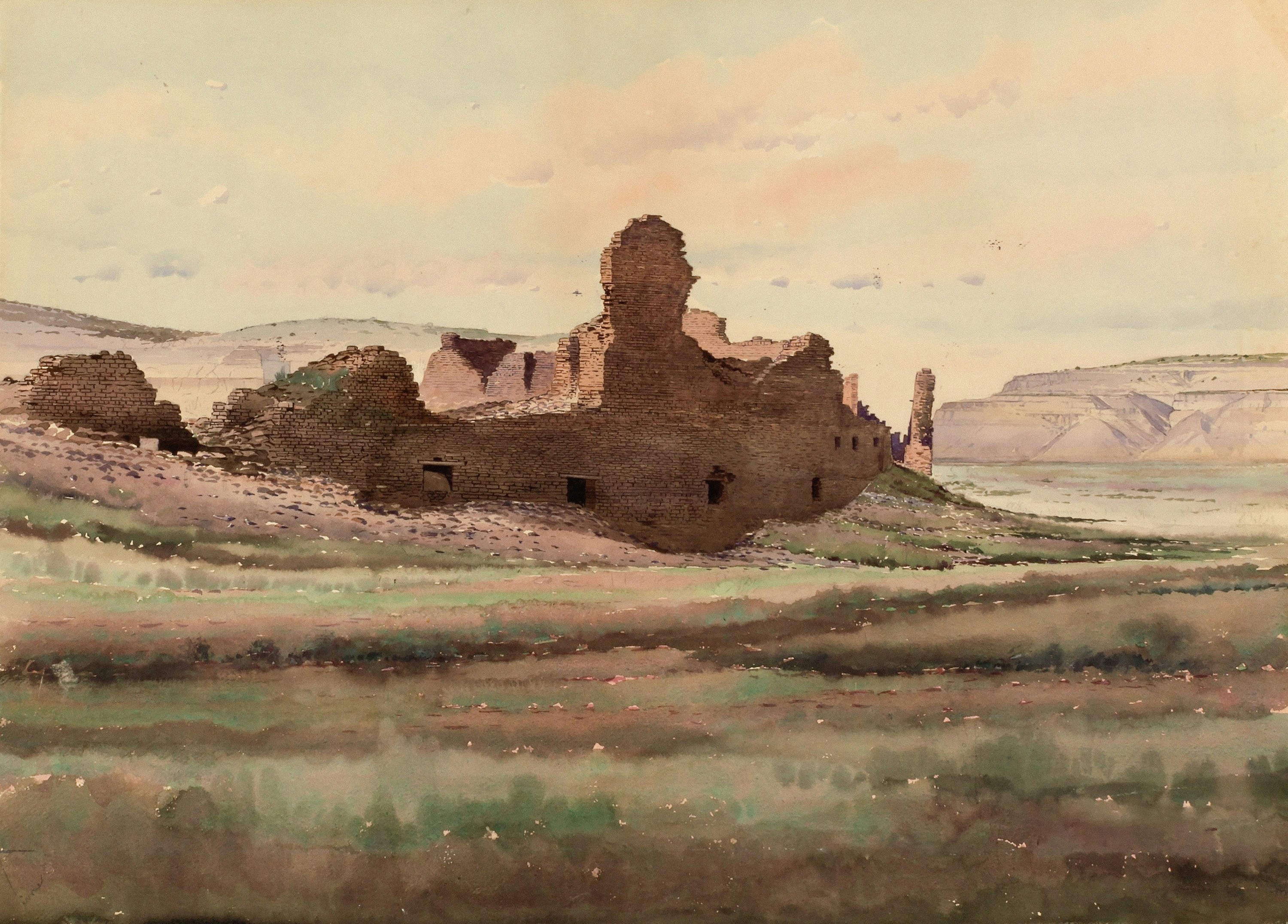 Ancient ruins in a grassy, arid landscape.