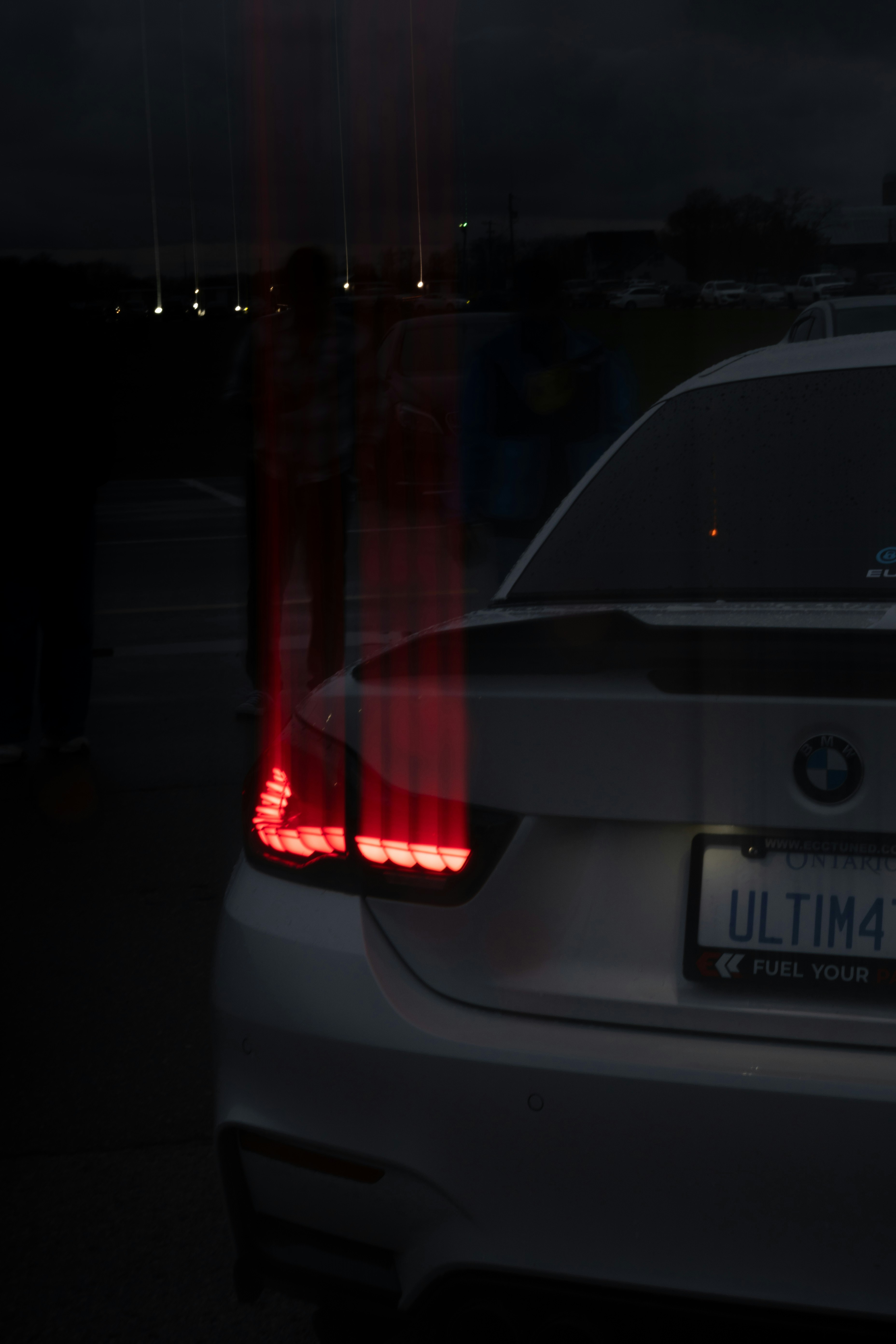 Car taillights glowing red at night