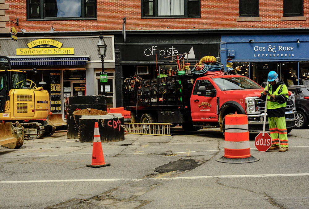 Road crew and trucks on a city street