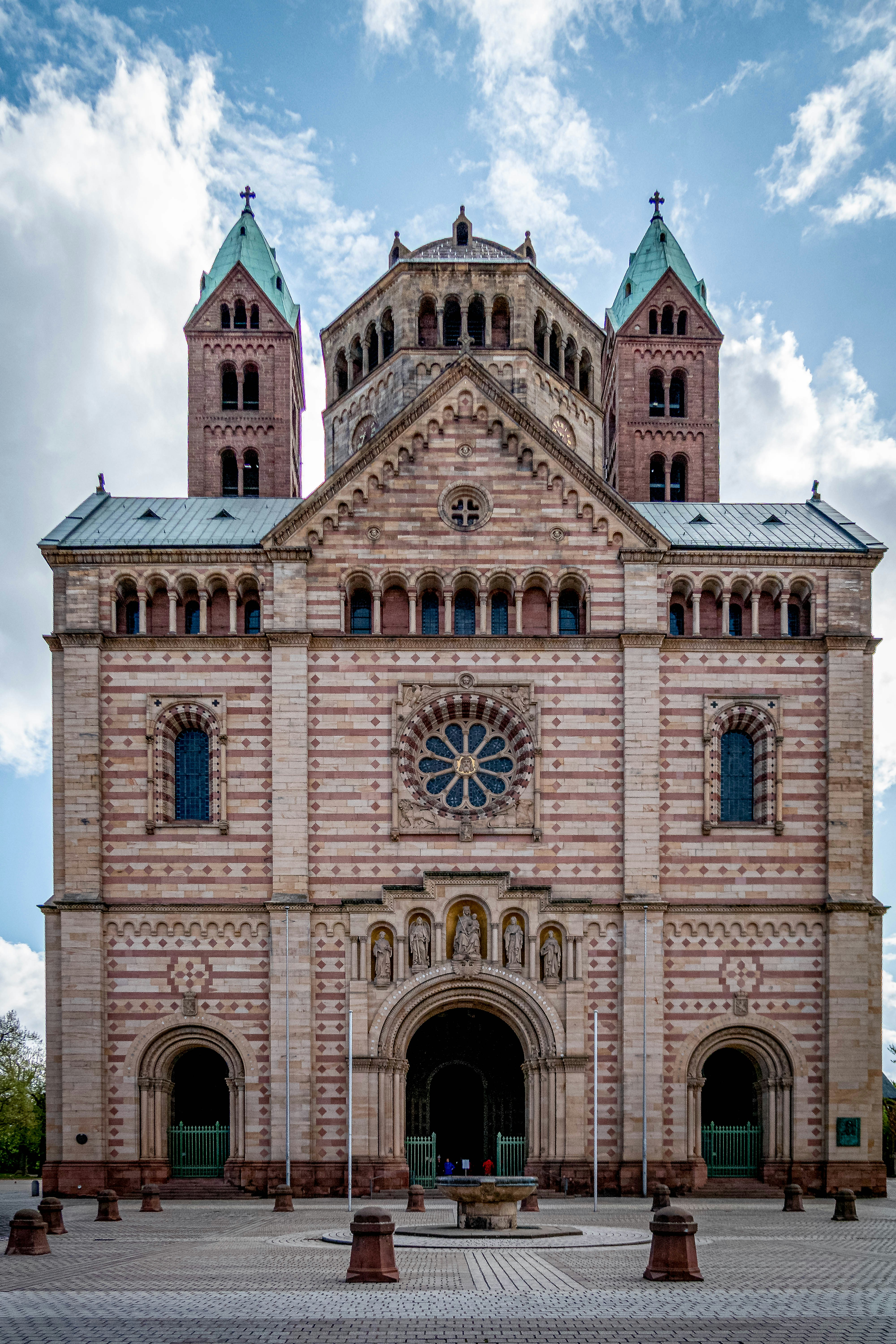 A grand cathedral with intricate stone carvings and towers.