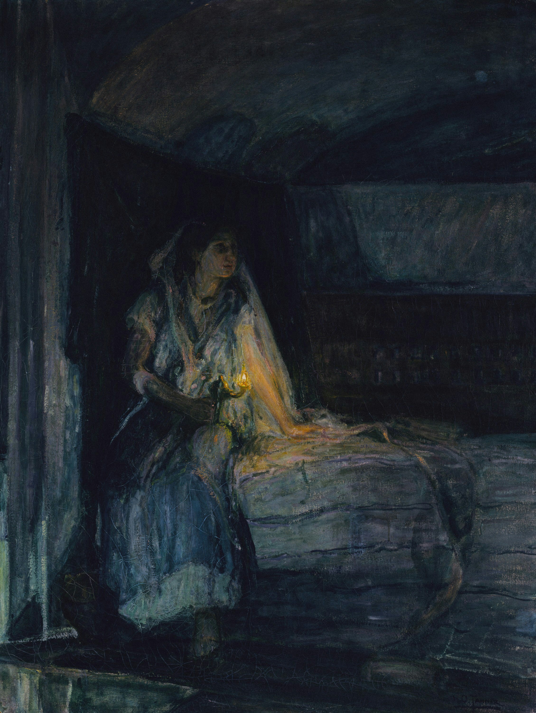 Woman holding a candle in a dark room