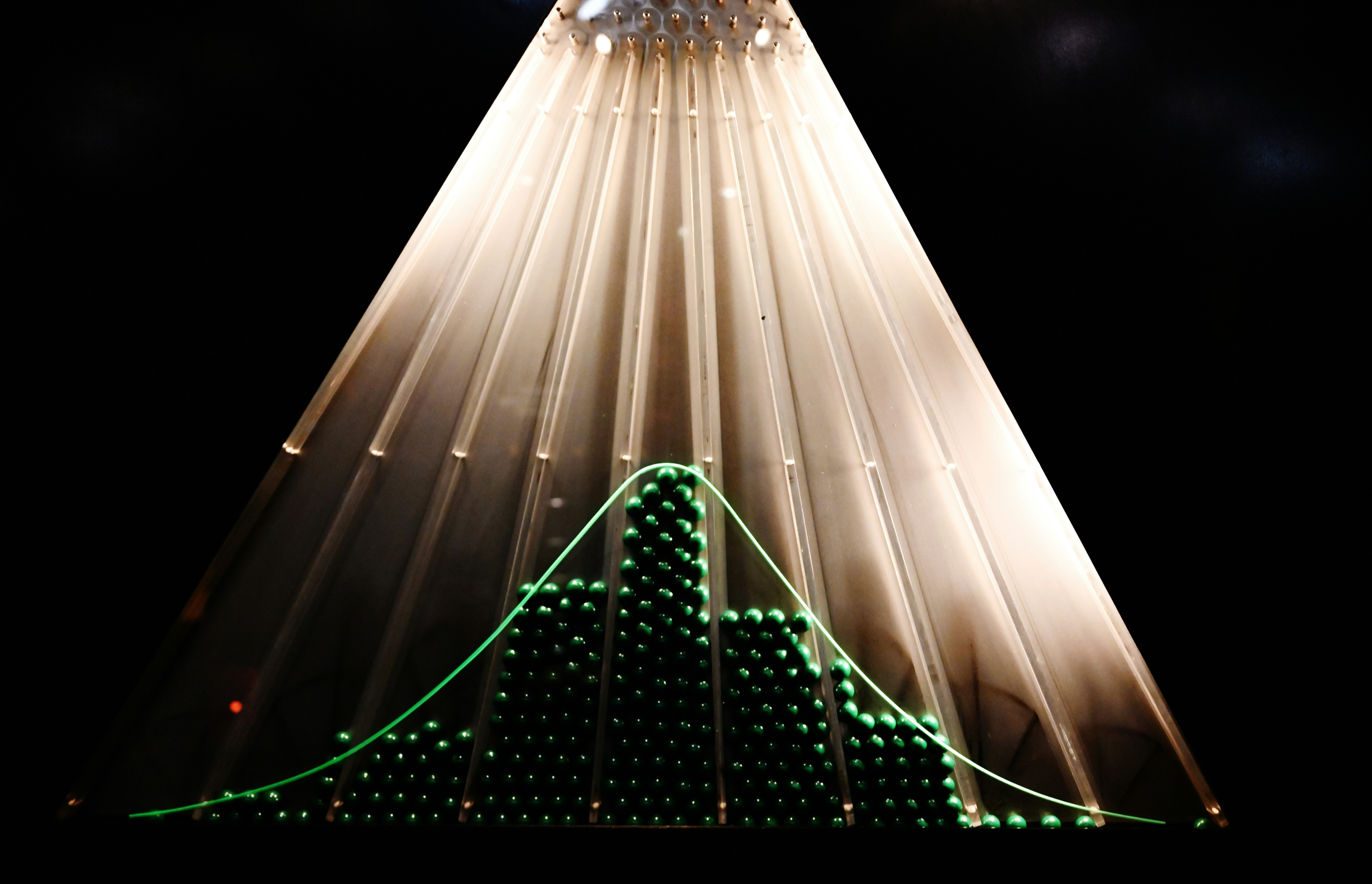 A bell curve graph with illuminated lights