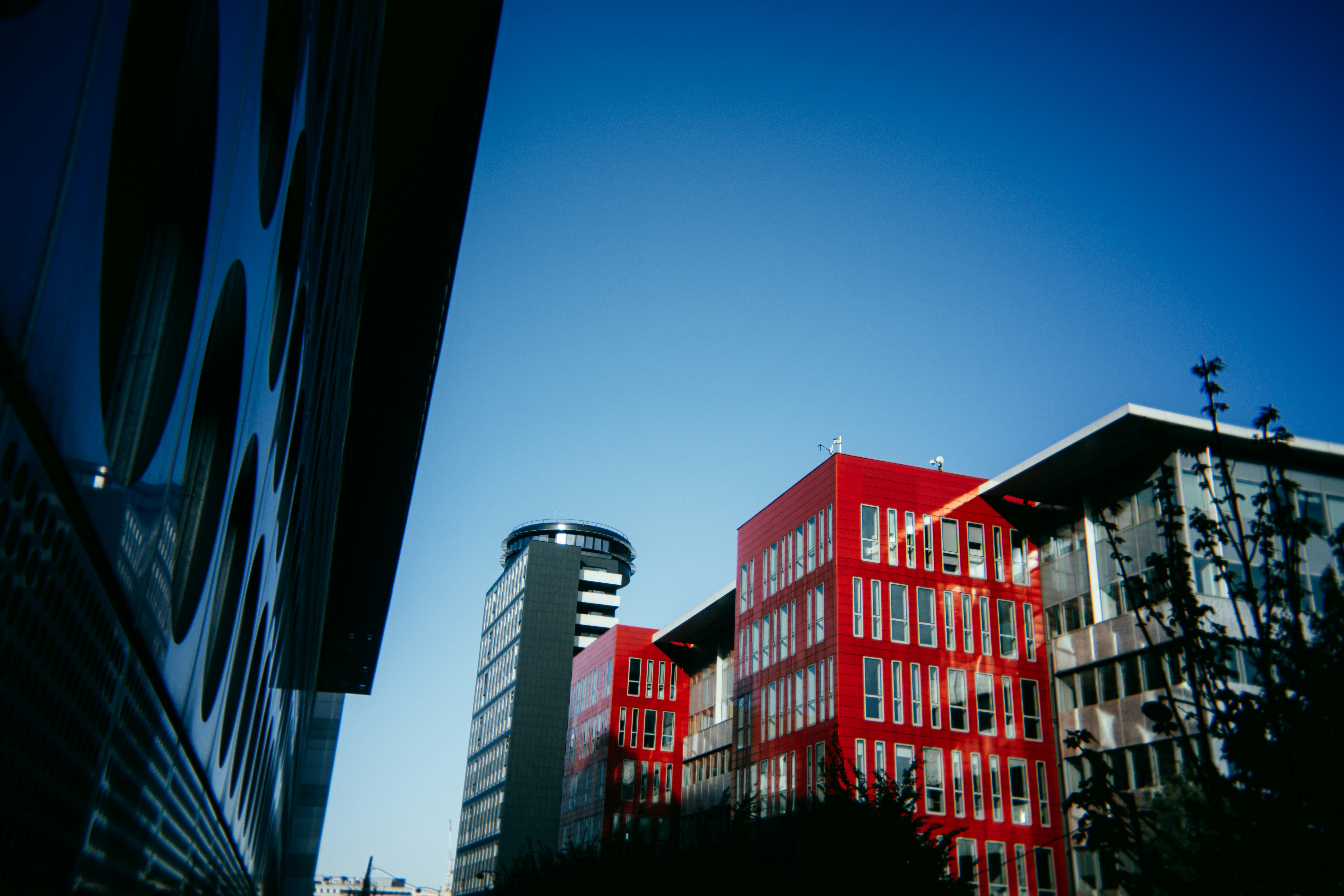 Modern buildings against a clear blue sky