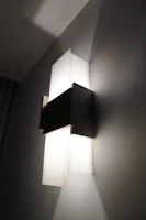 Modern wall sconce with geometric design