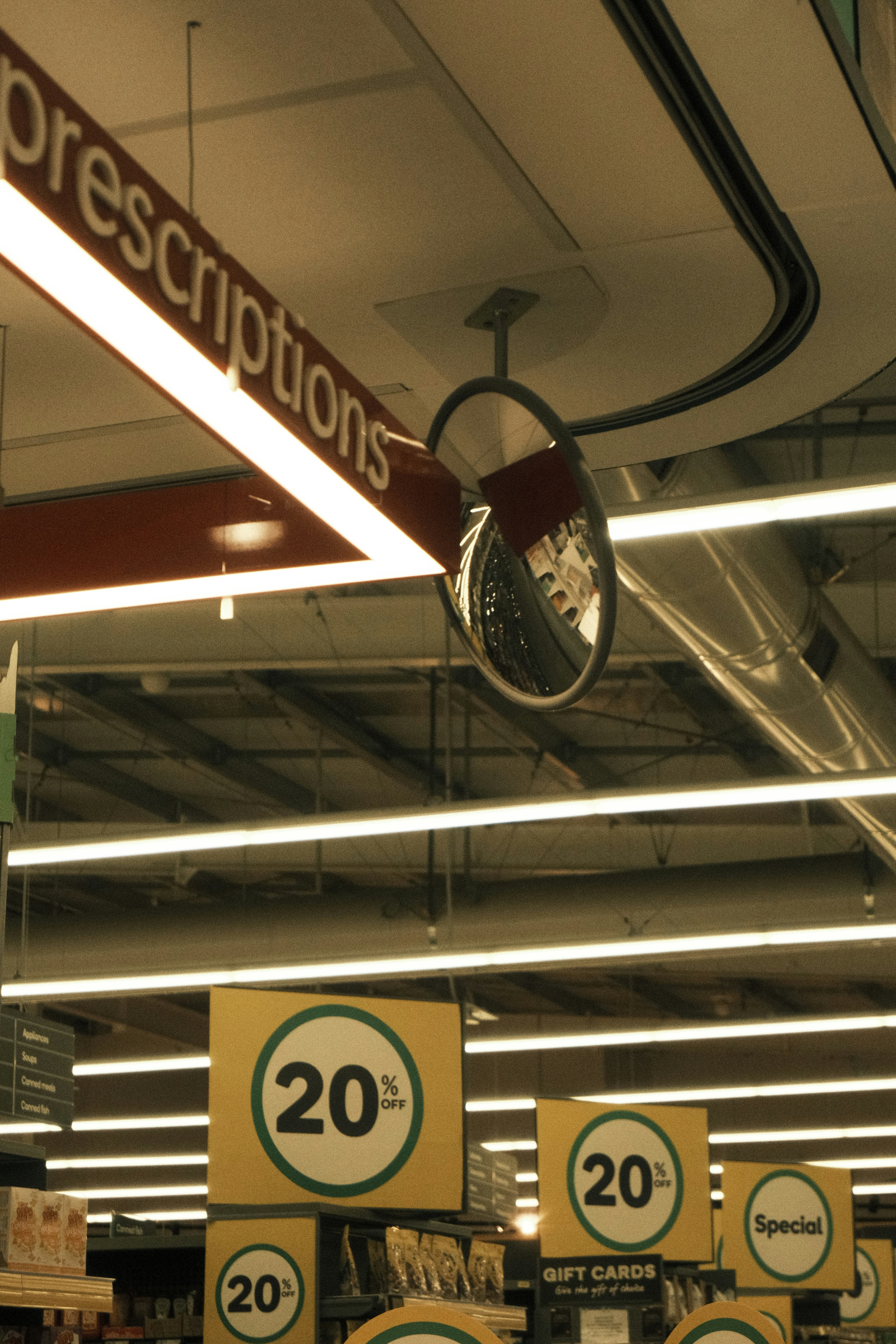 Store signage with discount and prescription information