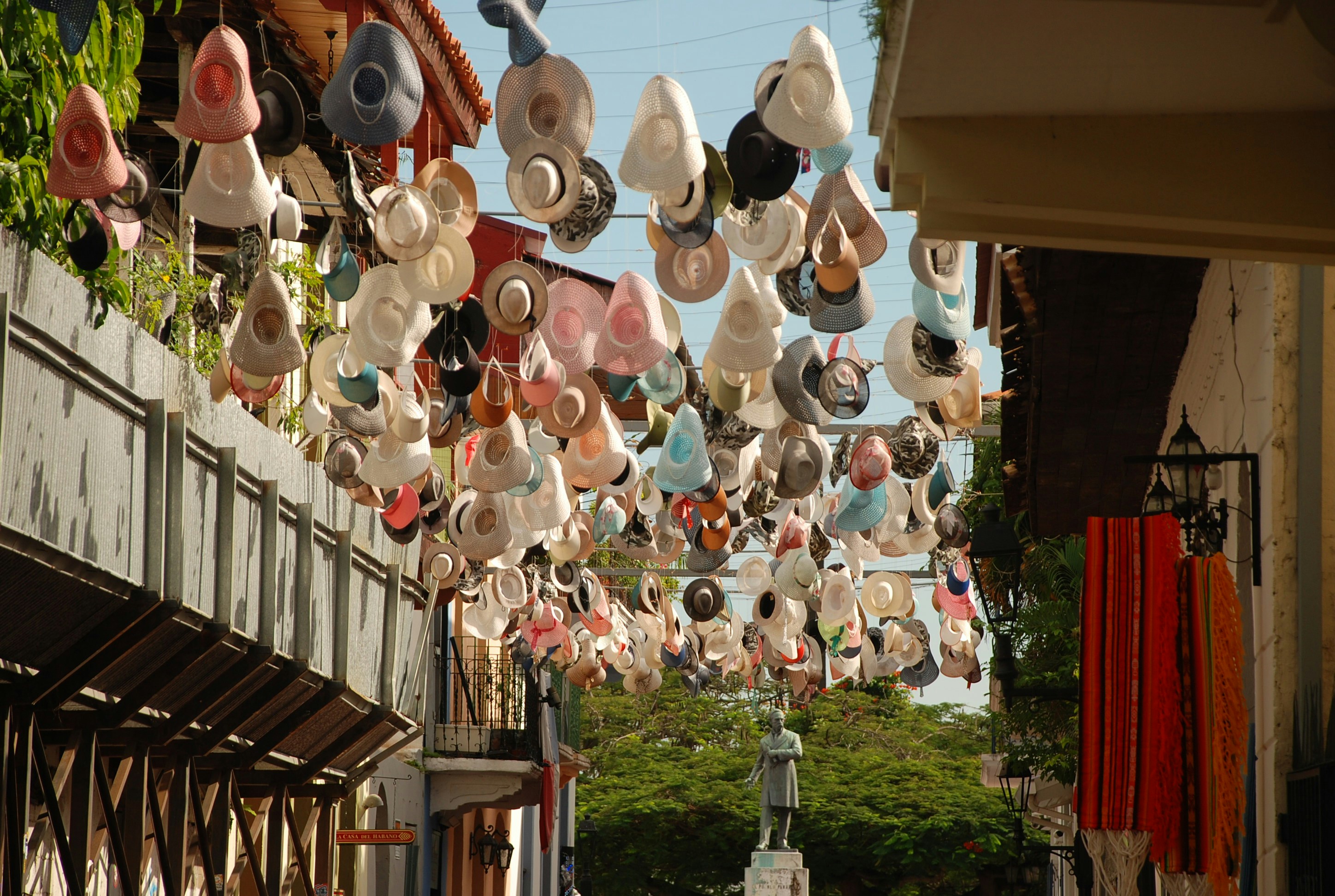 Hats hanging from a street overhead