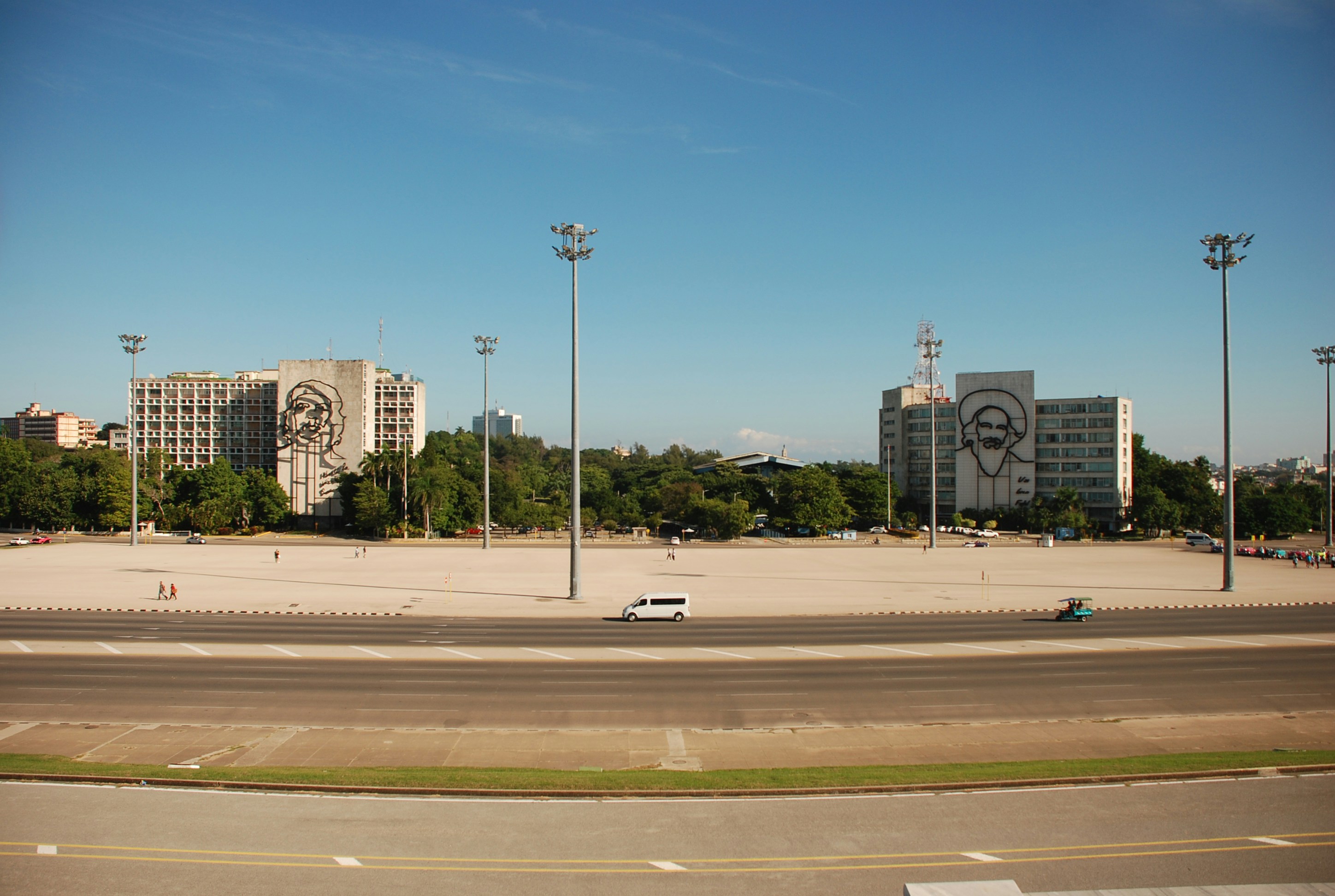 Large open plaza with buildings and trees
