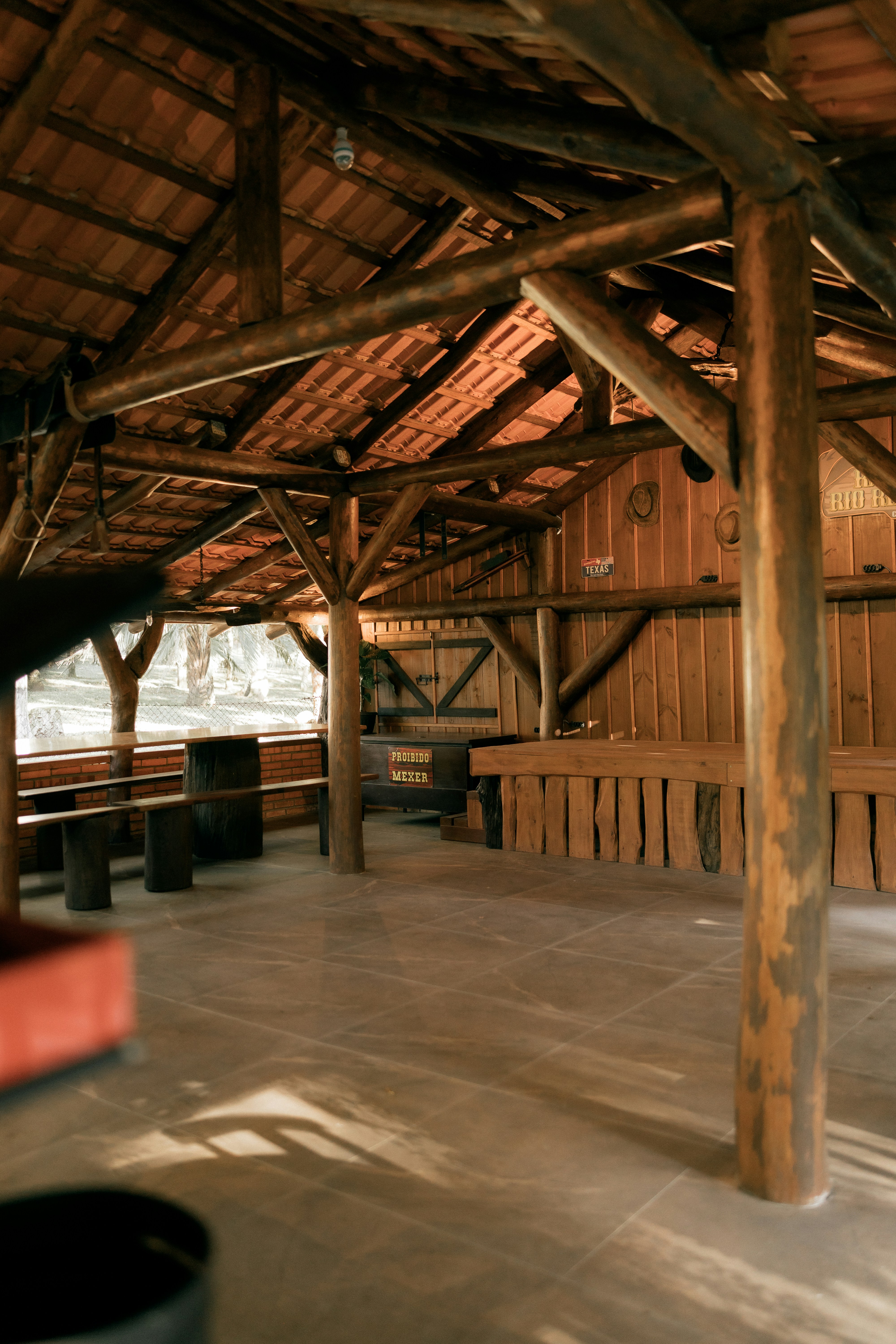 Rustic wooden interior with exposed beams and bar