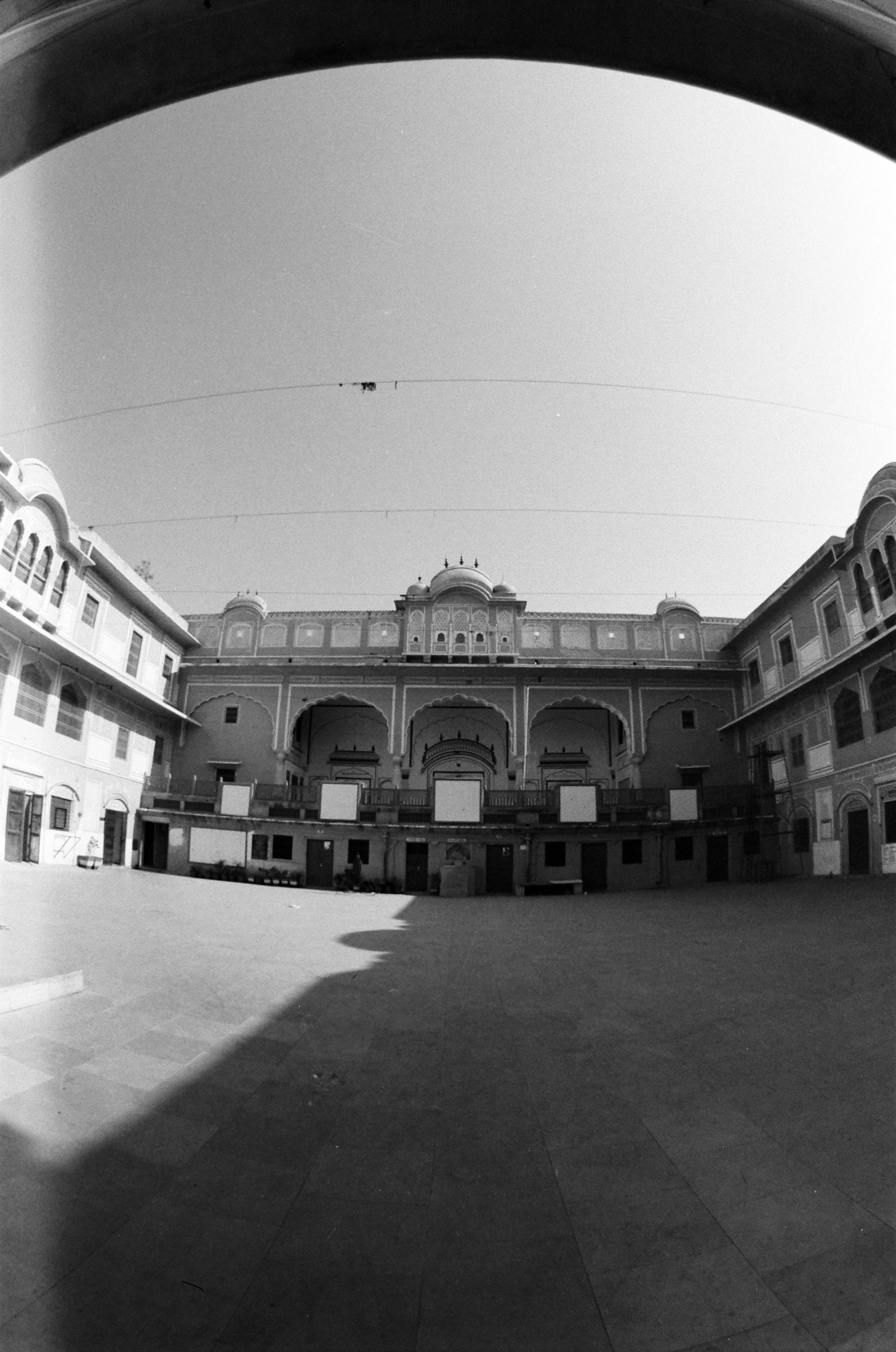 A palace courtyard with arched walkways