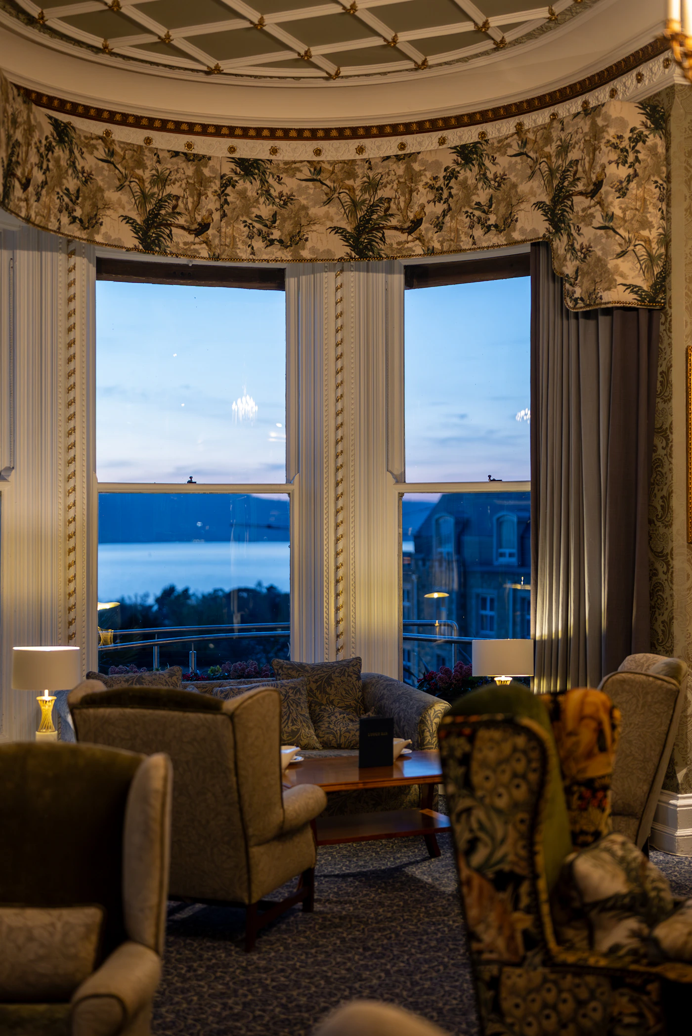 Elegant observation lounge with bay windows over water
