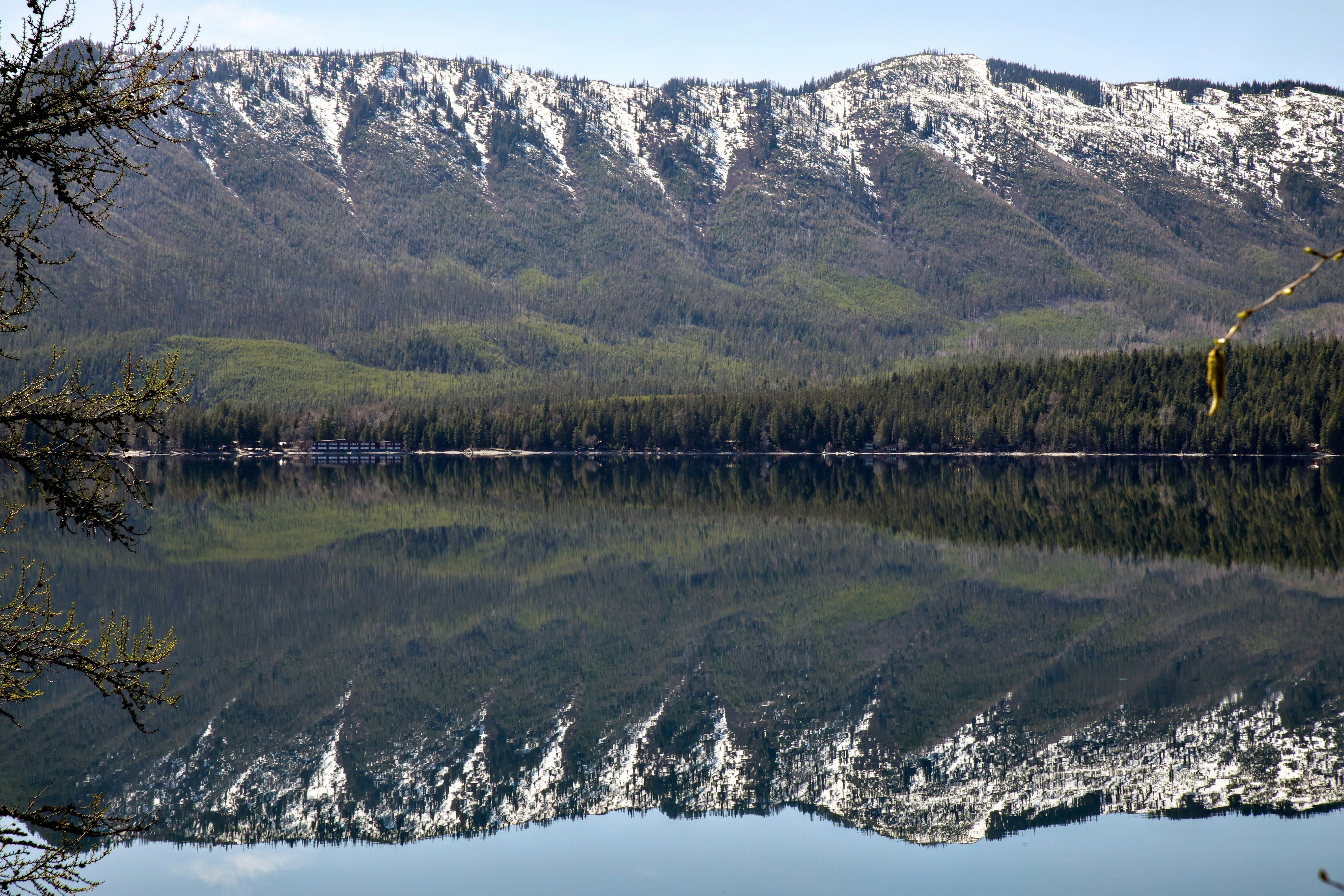 Snow-capped mountains reflected in a calm lake