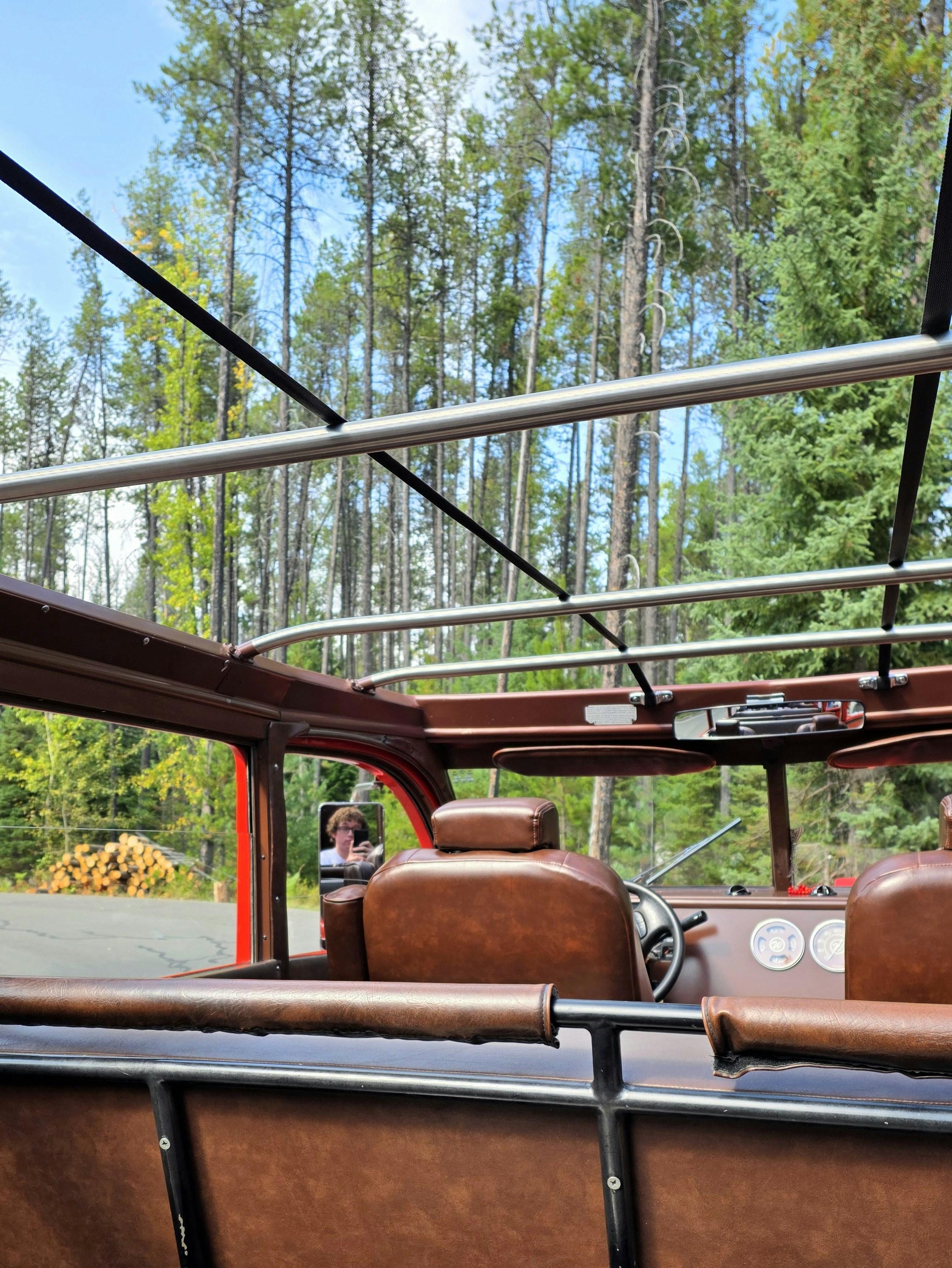 Vintage tour bus interior with forest background