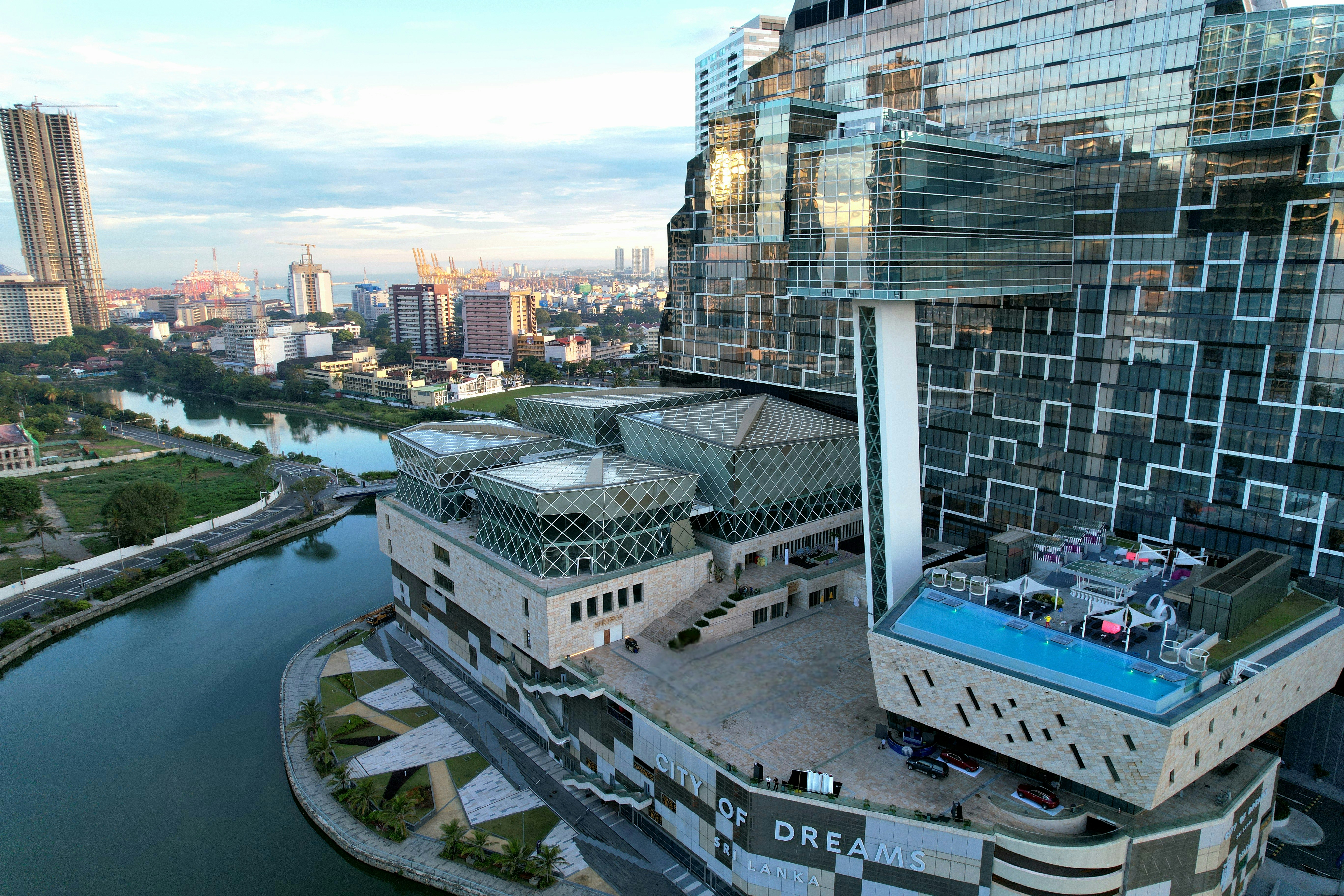 Modern cityscape with a river and unique architecture