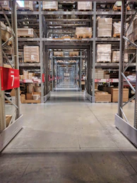 Warehouse storage aisles with shelves full of boxes