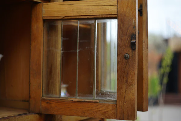 Wooden cabinet with glass panes