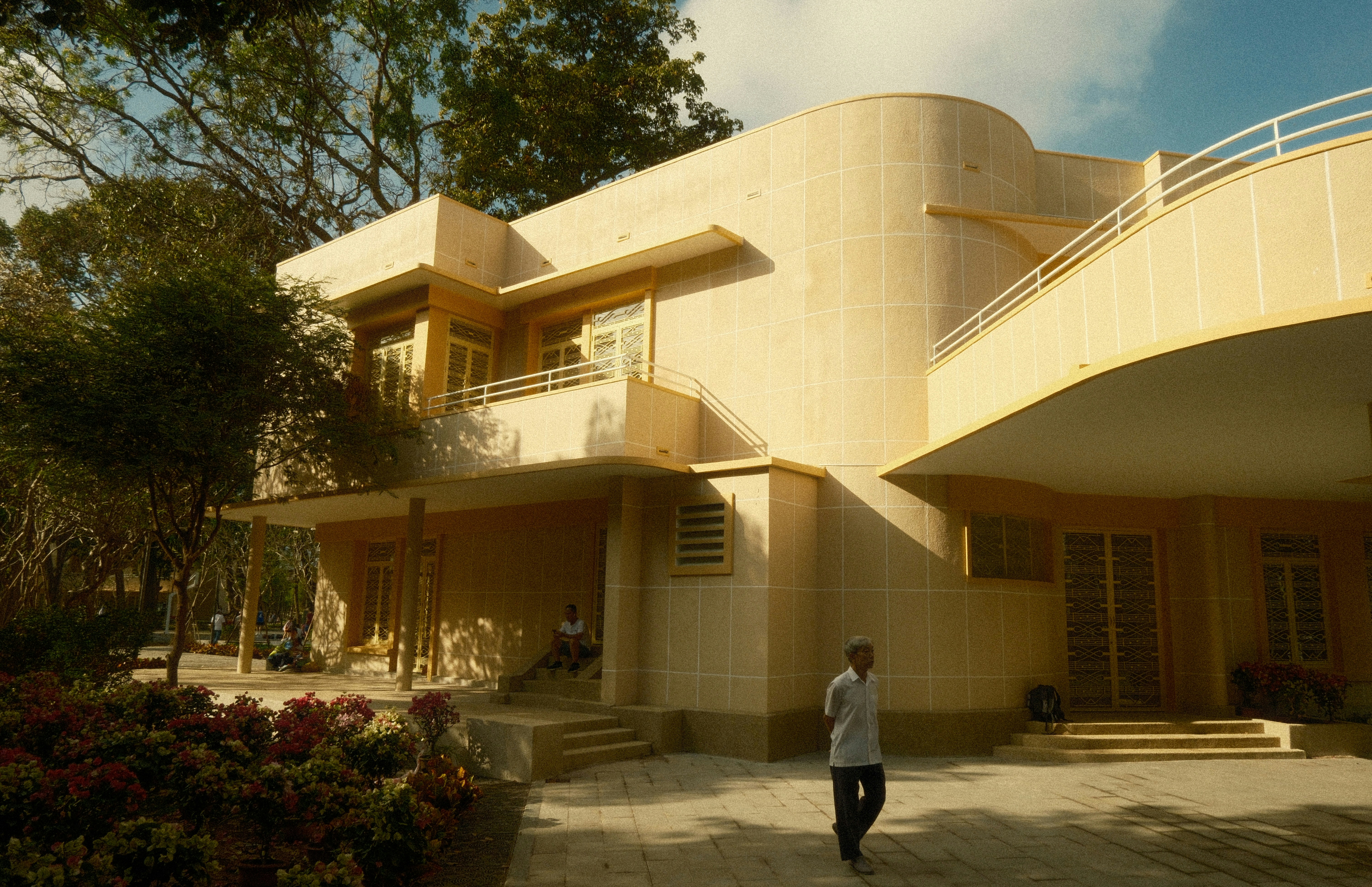 A modern building with curved architecture and balconies.