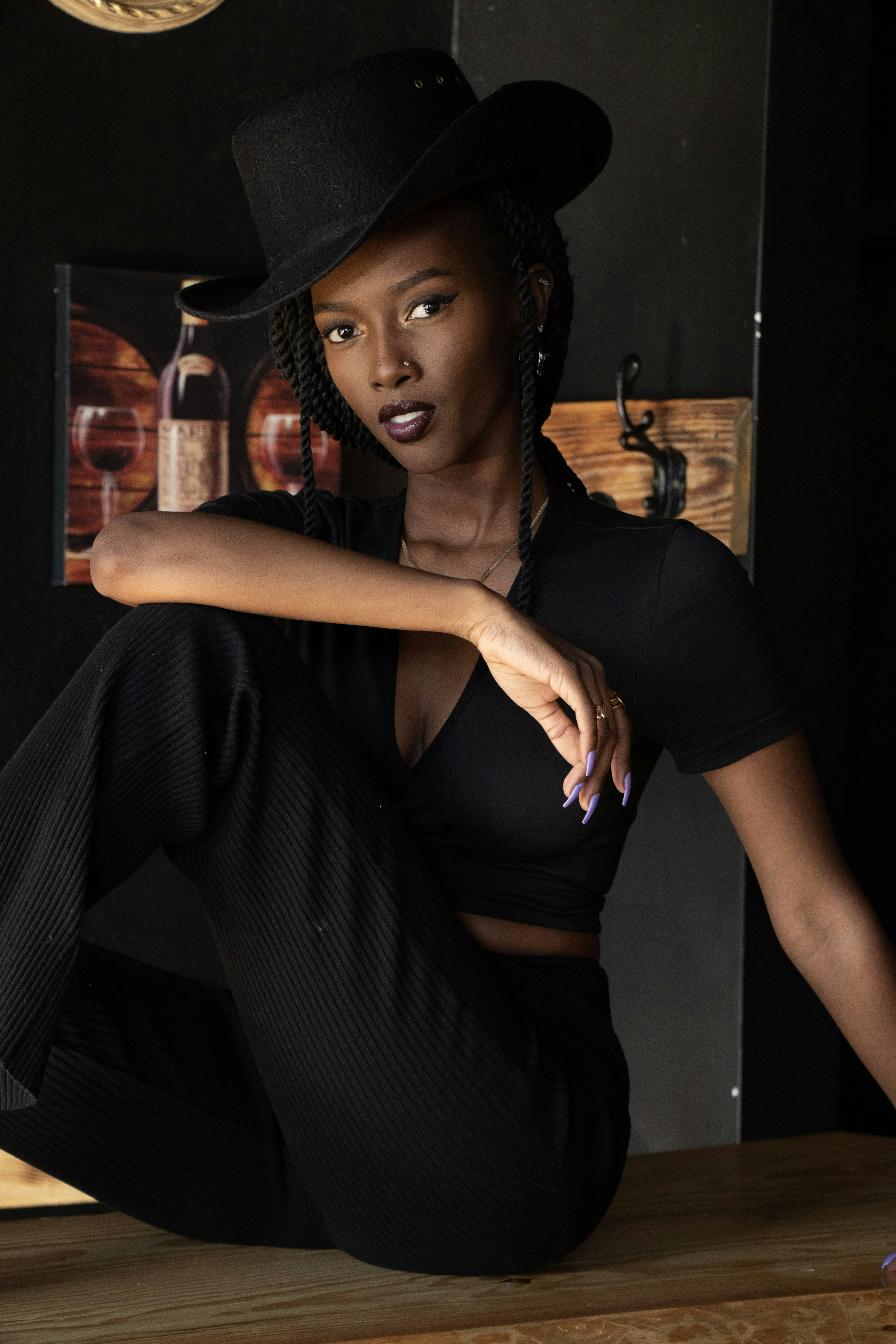Woman in black cowboy hat and outfit