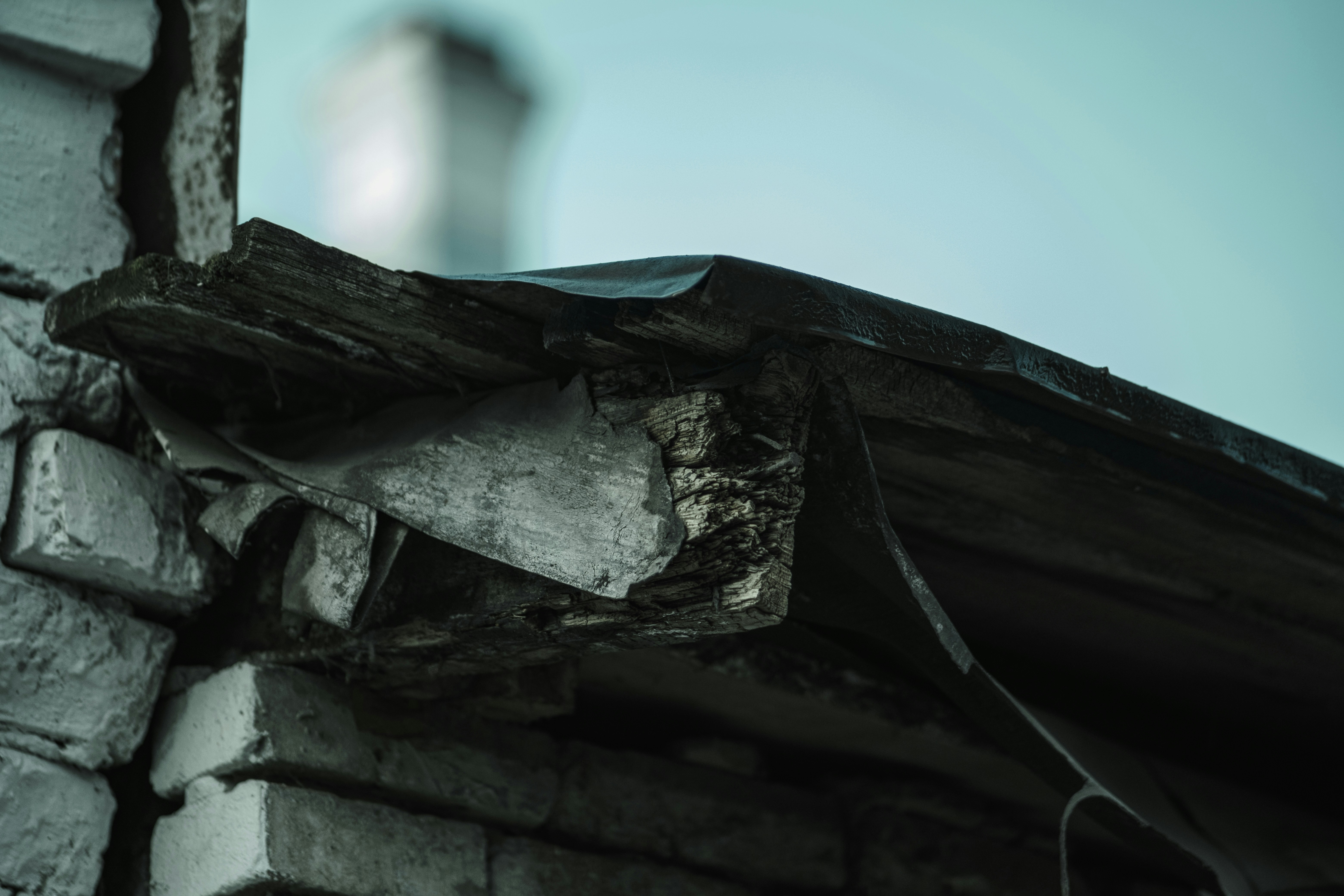 Damaged roof edge on a brick building