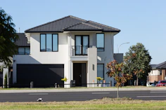 Modern two-story house with a dark garage door