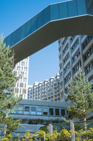 Two modern buildings connected by an elevated pedestrian skybridge, similar to the two pedestrian bridges included in the approved Las Vegas medical tower plan