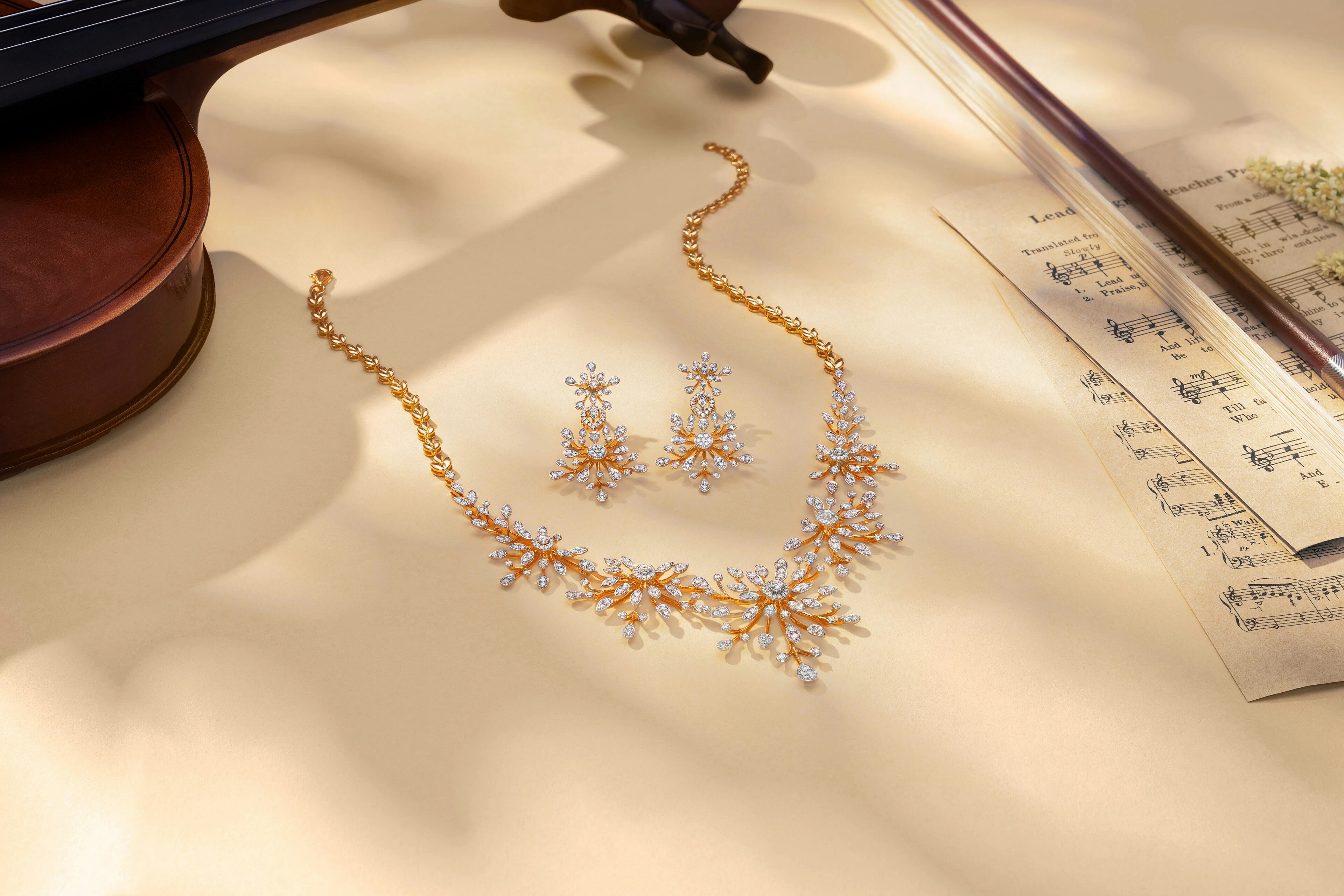 Diamond necklace and earrings with musical notes.